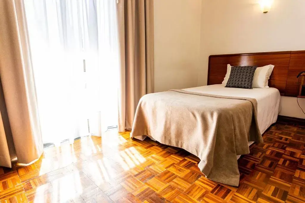 Bed in Dona Amélia Hotel by RIDAN Hotels