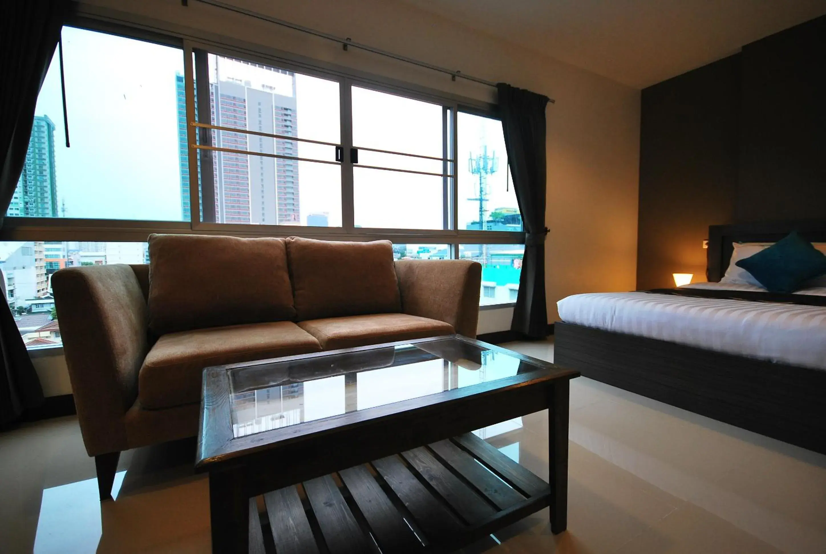 Bed, Seating Area in Baan Mina