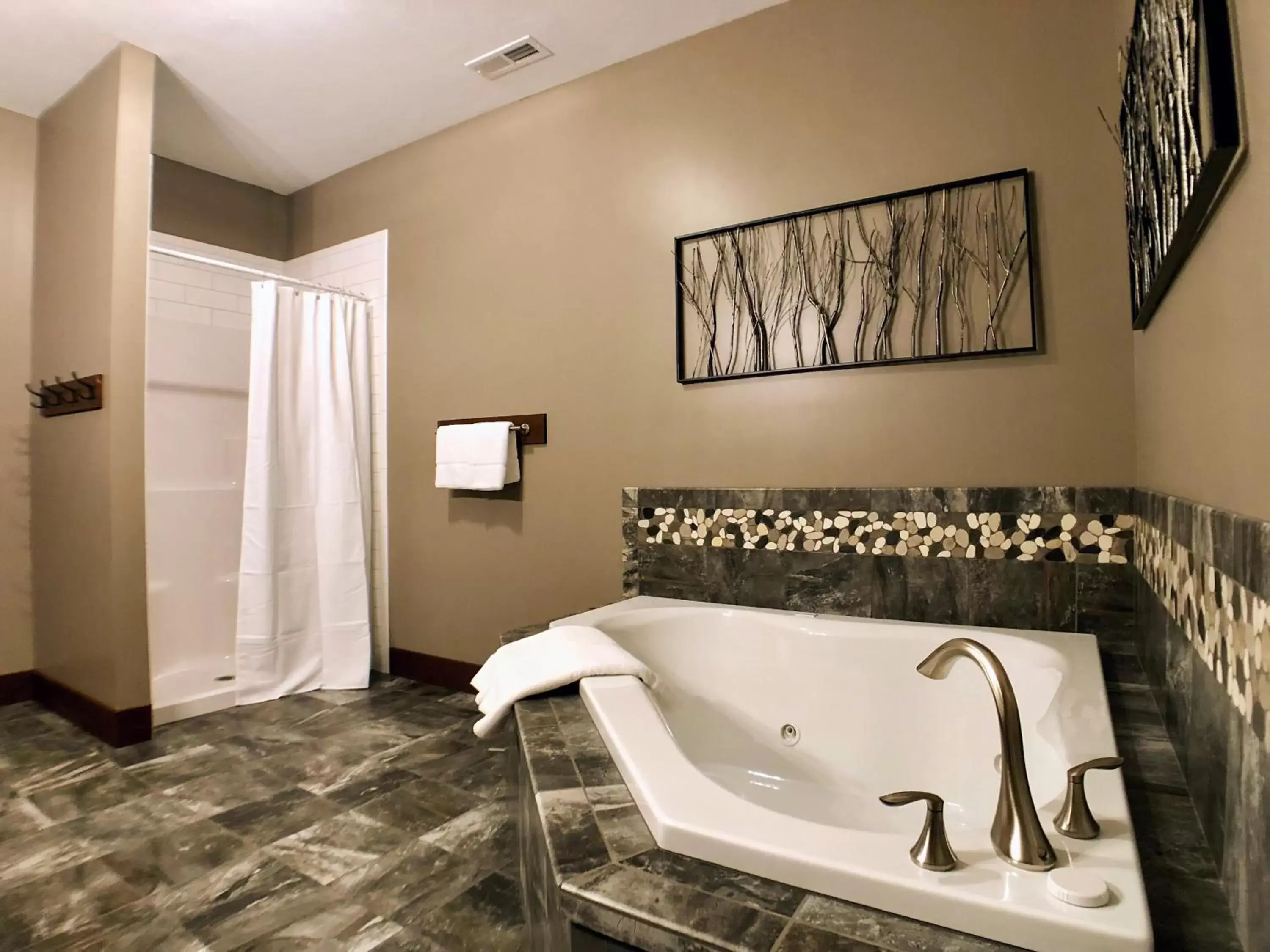 Bathroom in Sojourner's Lodge & Log Cabin Suites