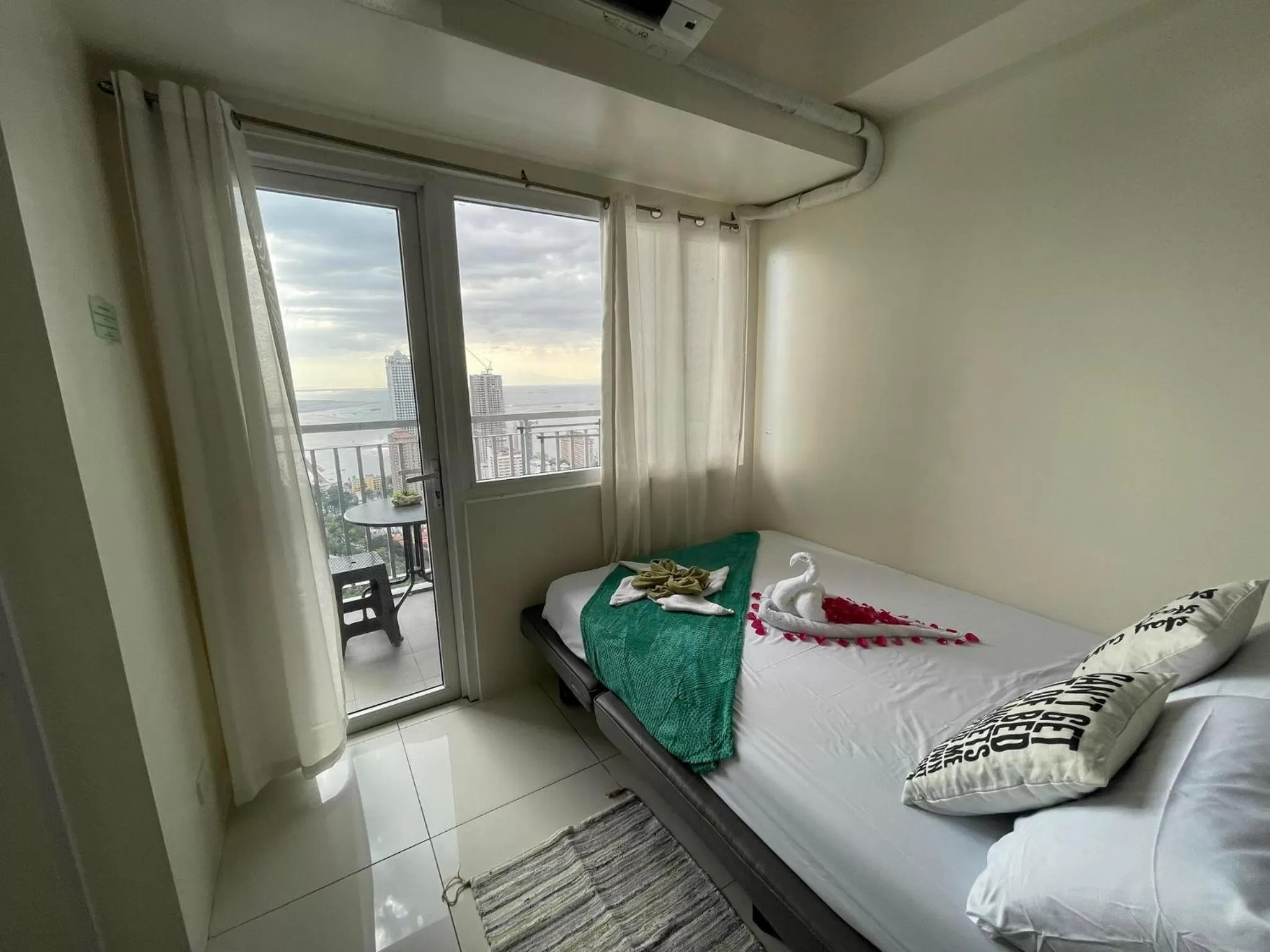 Bed in Green Residences Stays by PBYY