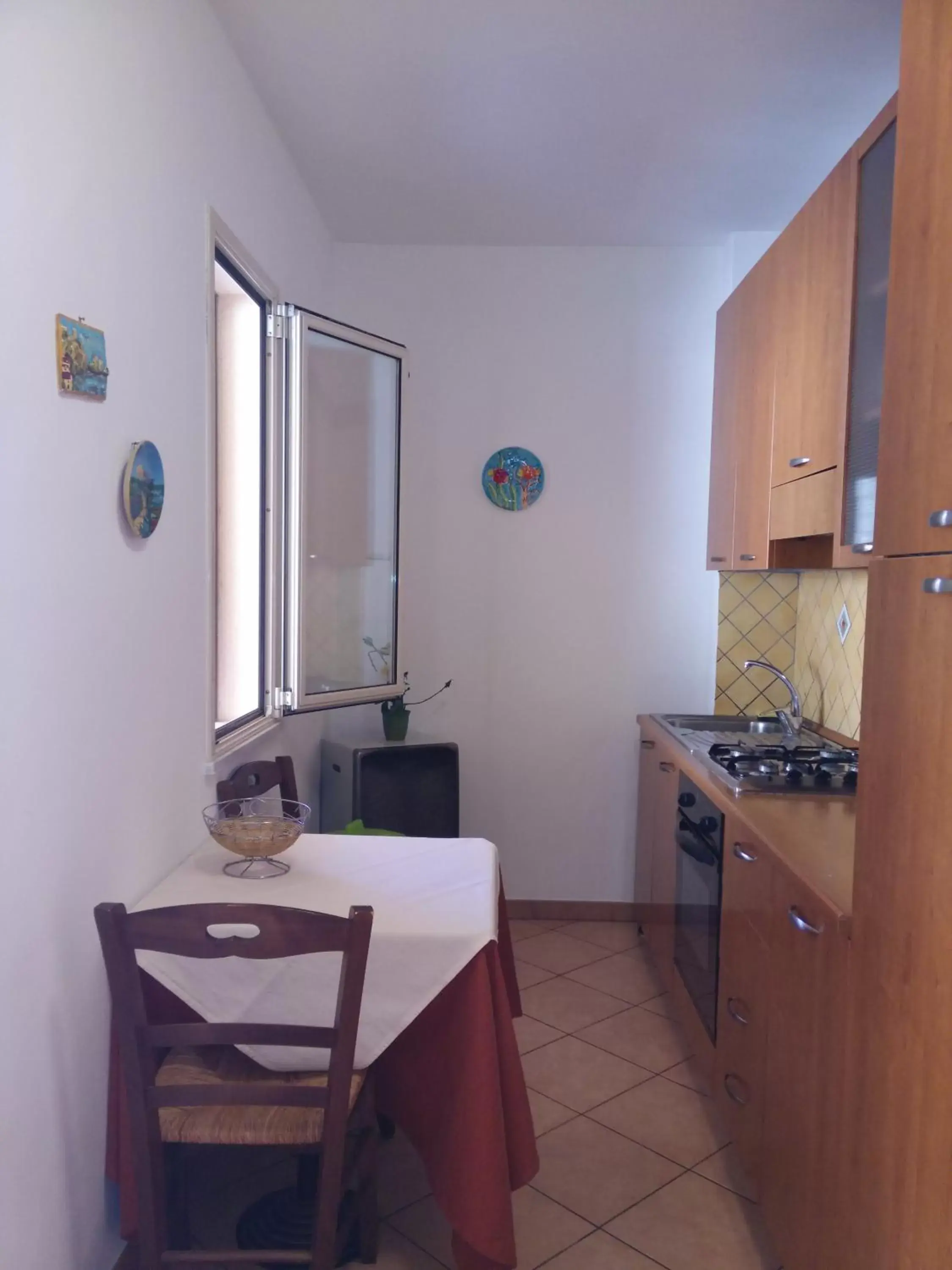 Living room, Kitchen/Kitchenette in Locanda Scirocco