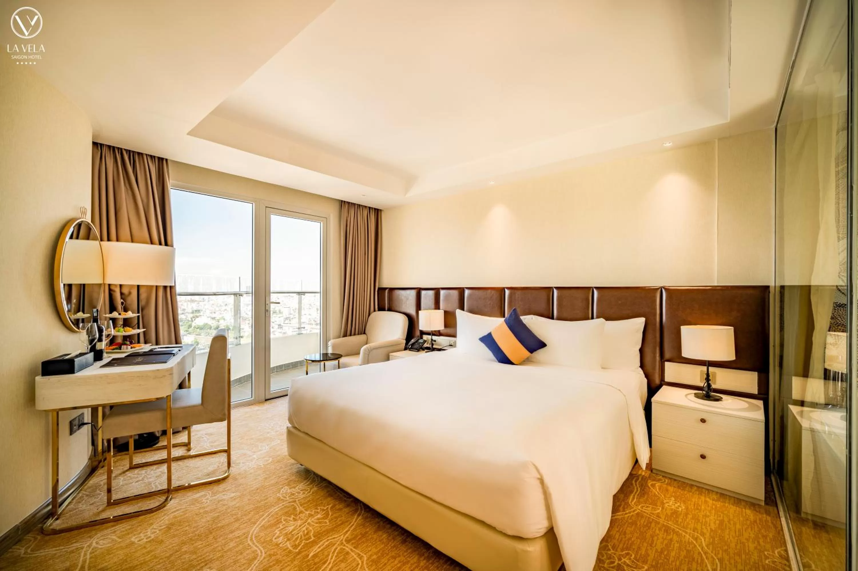 Bed in La Vela Saigon Hotel