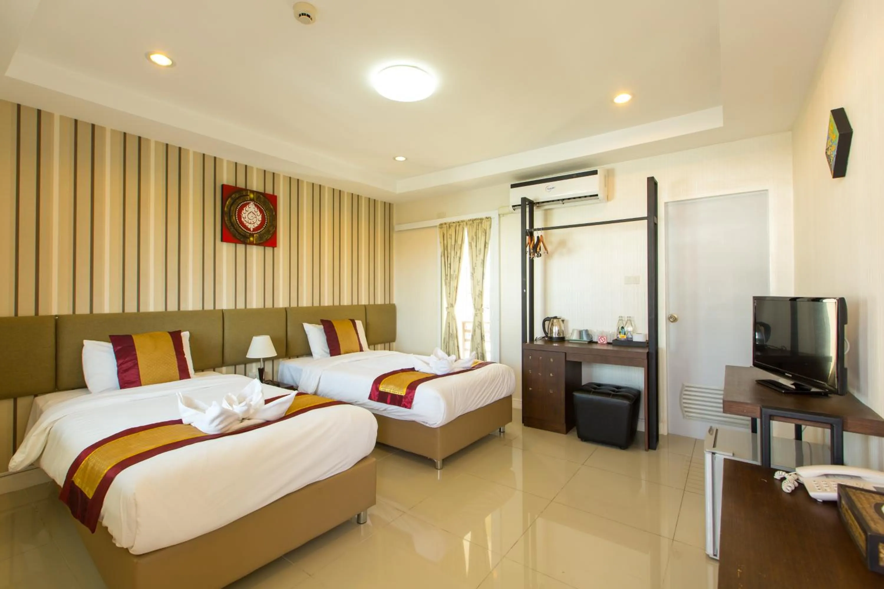 Photo of the whole room, Bed in Chiang Mai Waroros Boutique Hotel