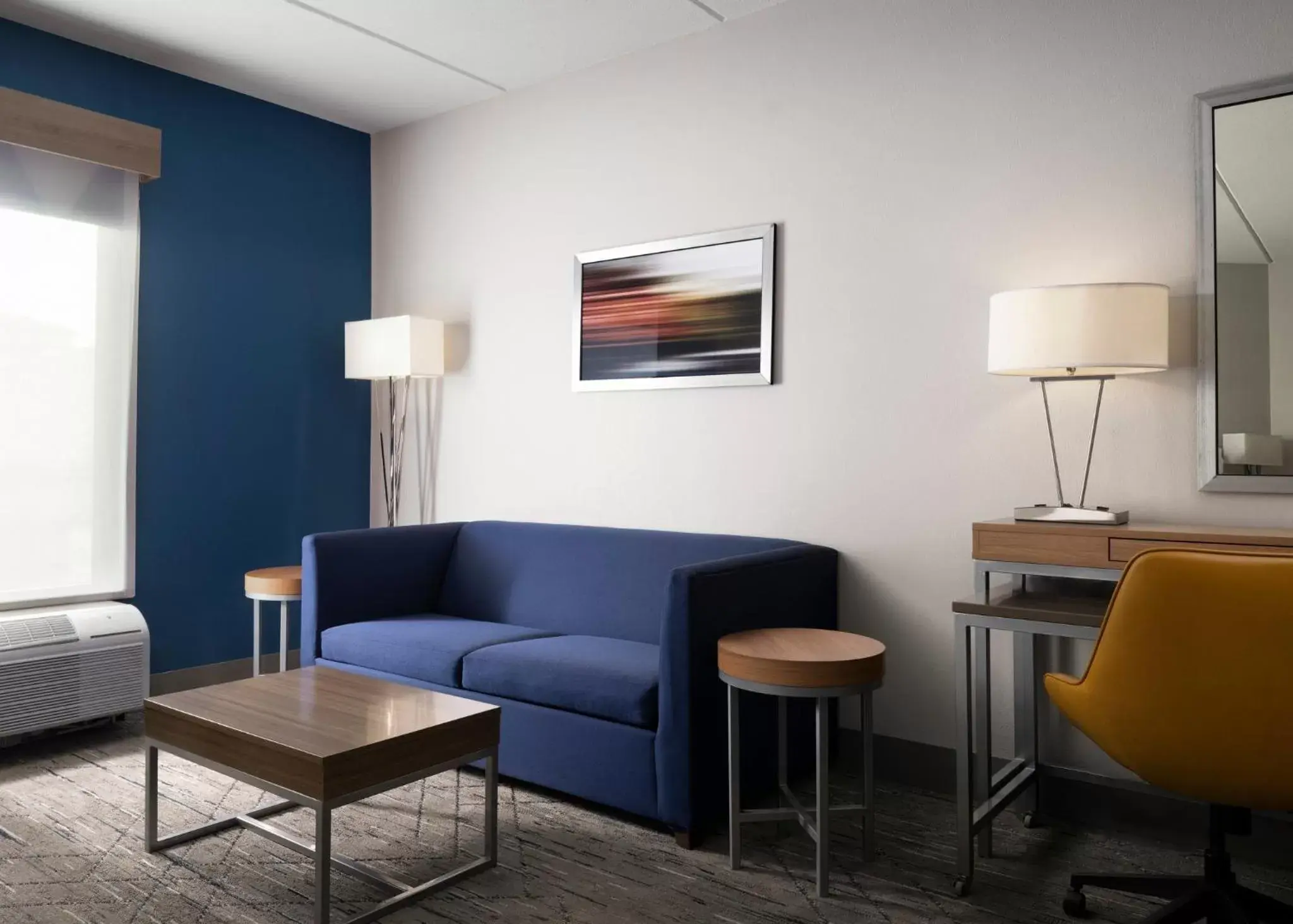 Bedroom, Seating Area in Holiday Inn Express and Suites New Orleans Airport, an IHG Hotel