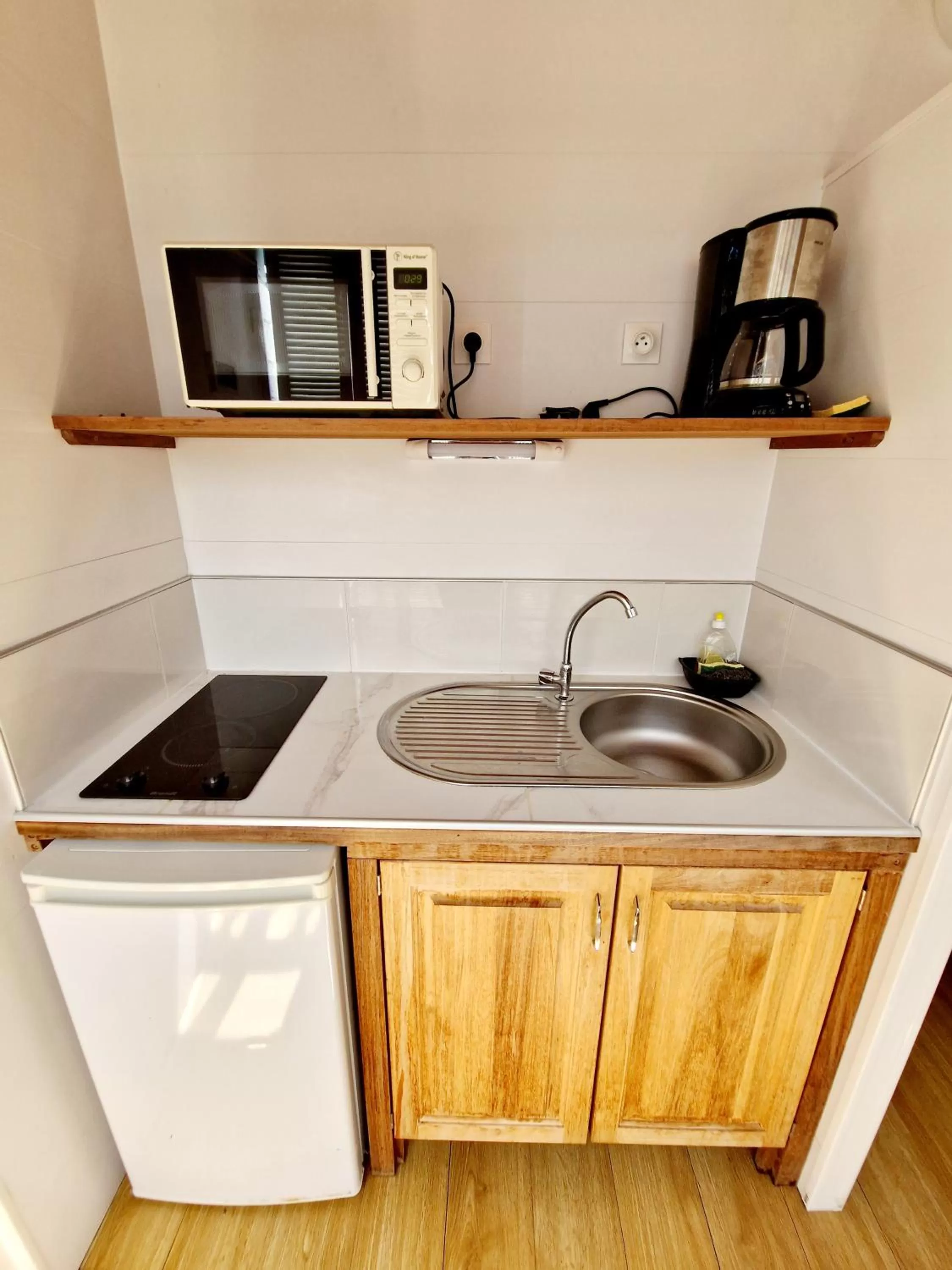Kitchen or kitchenette in Hotel Le Manguier