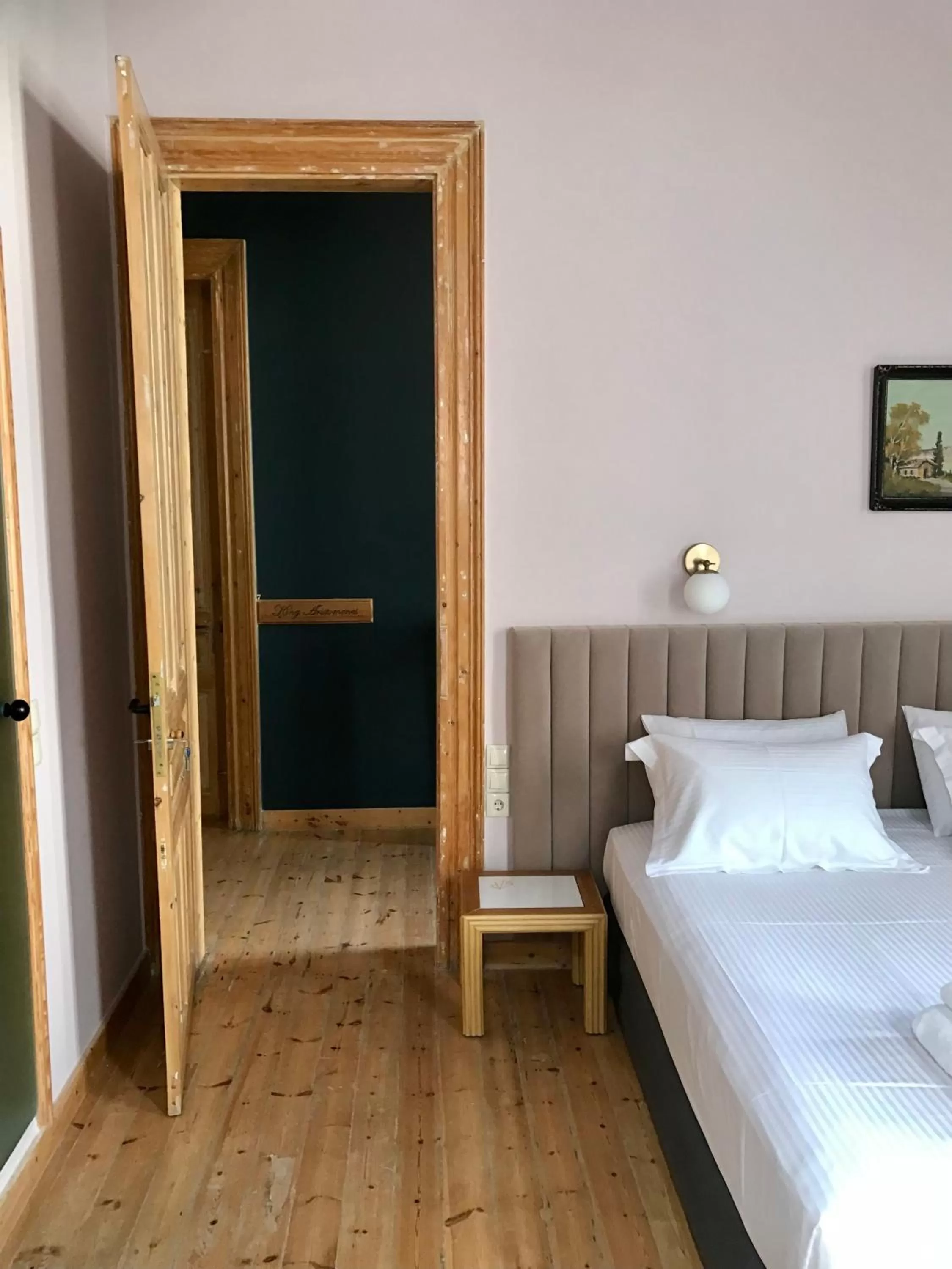 Photo of the whole room, Bed in VASILIKON Hotel 1888 the past is present HISTORICAL PRESERVATION MONUMENT