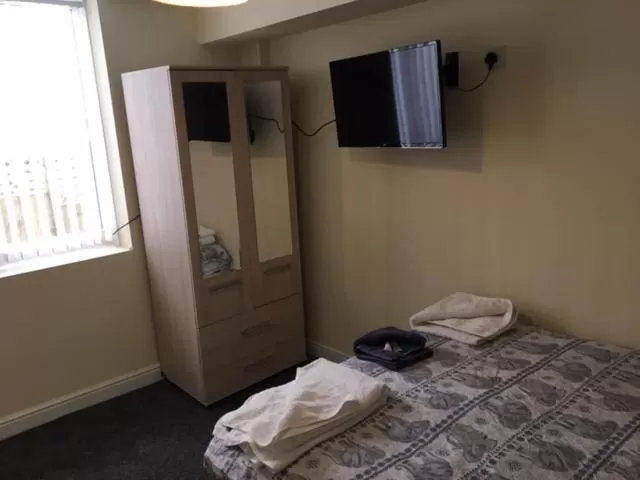 Bed in The Winter Garden Suites