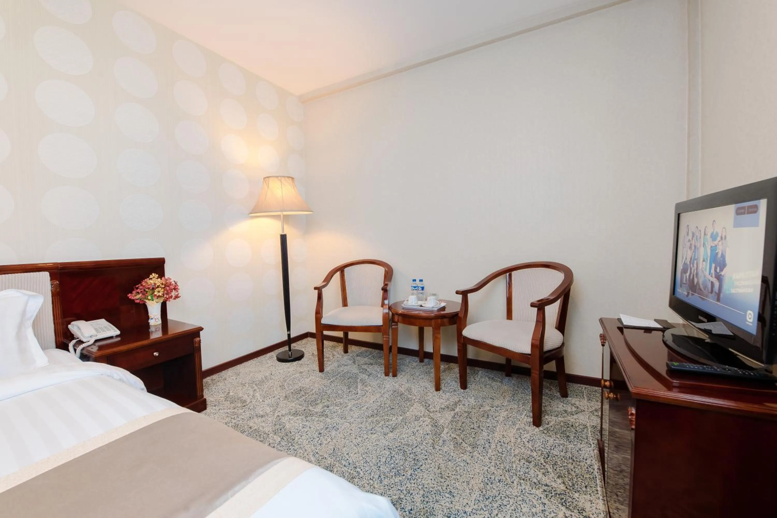 Communal lounge/ TV room, Bed in Springs Hotel Ulaanbaatar