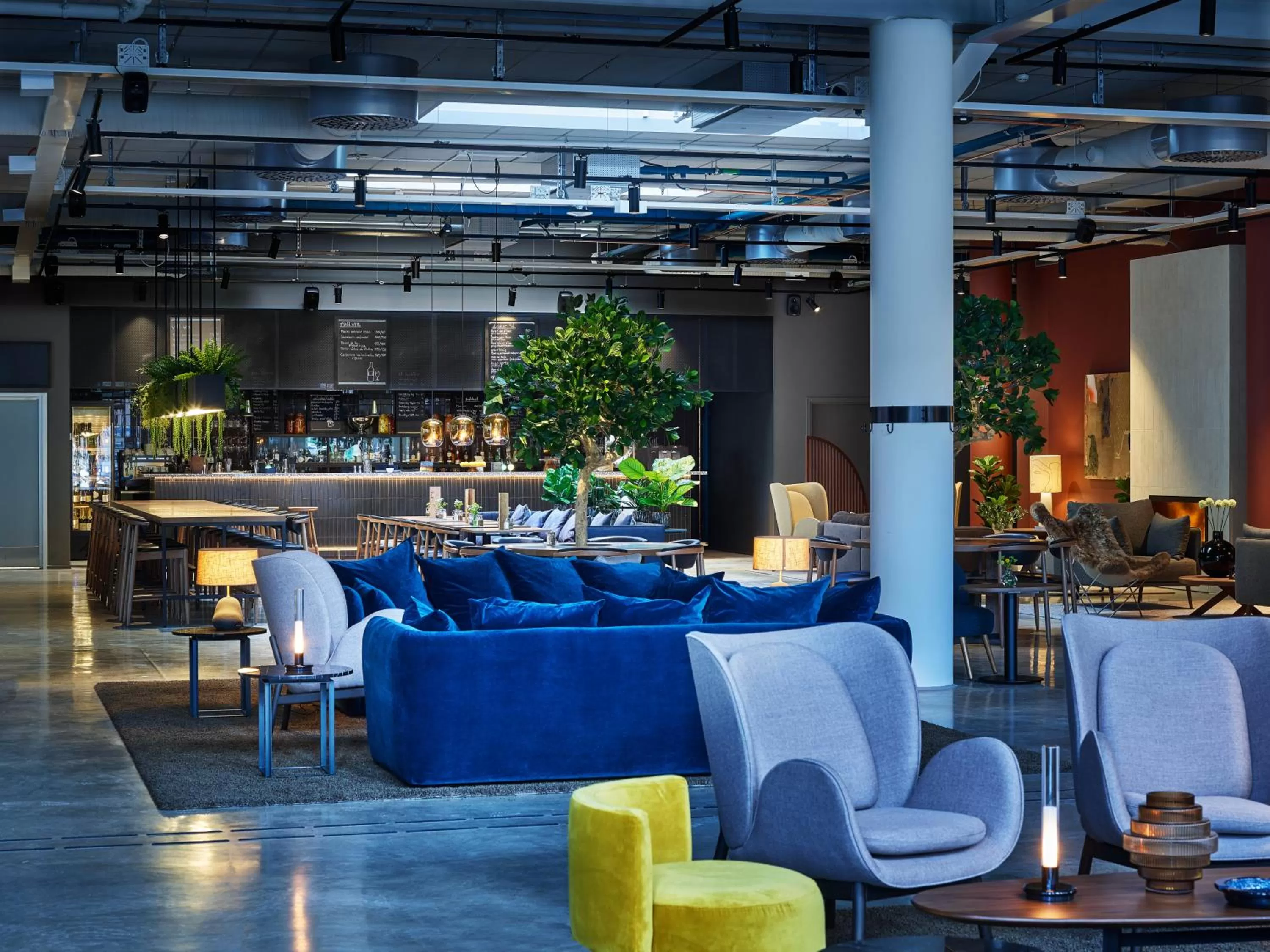 Communal lounge/ TV room in Clarion Collection Hotel Tapetfabriken