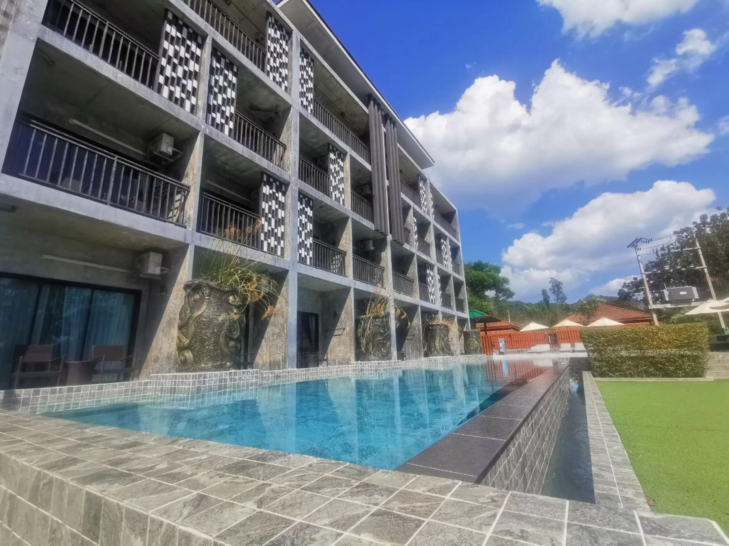 Swimming pool, Property Building in Maneetel Krabi Beachfront-SHA Plus