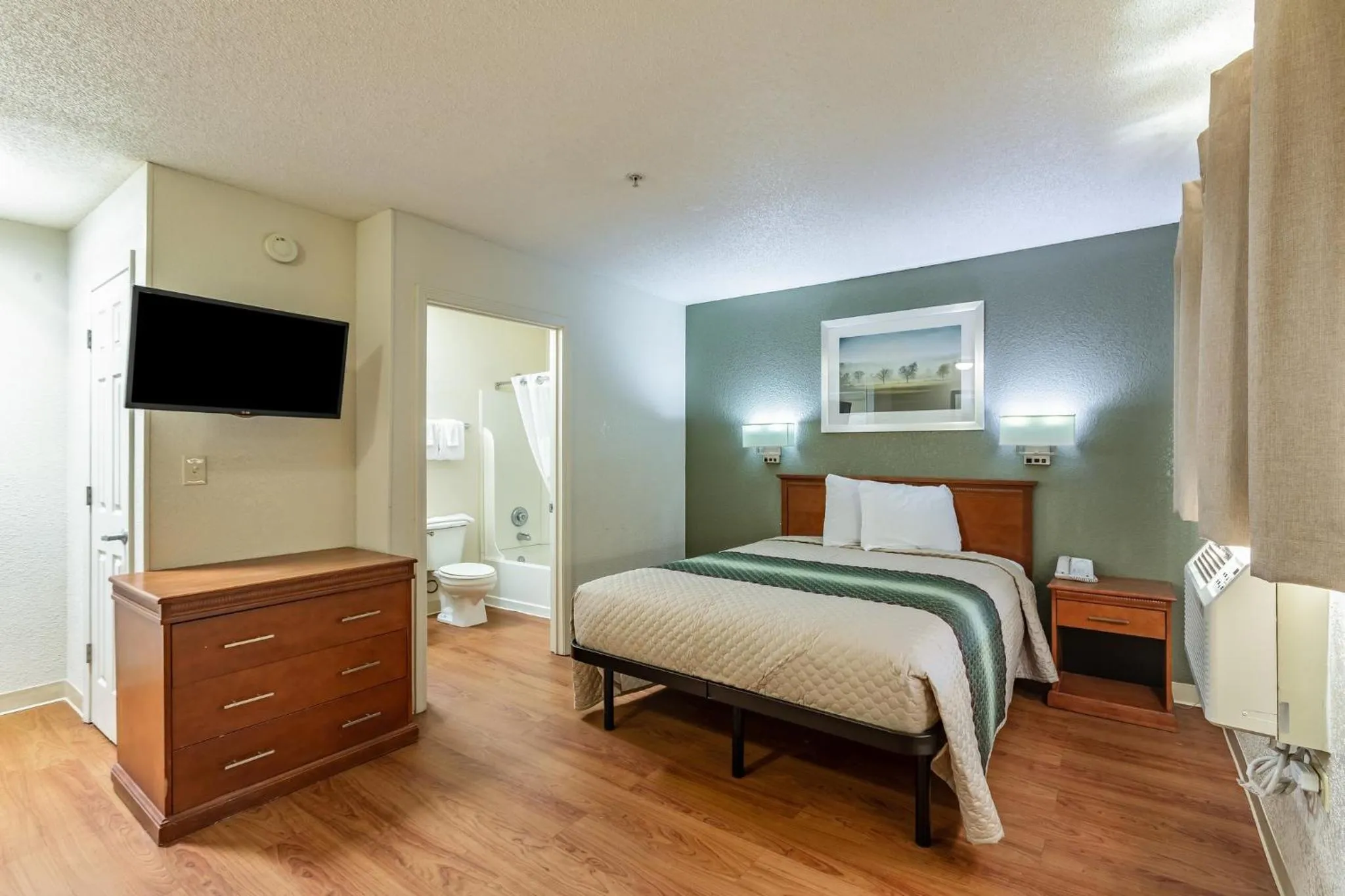 Photo of the whole room, Bed in HomeTowne Studios by Red Roof Gainesville, GA