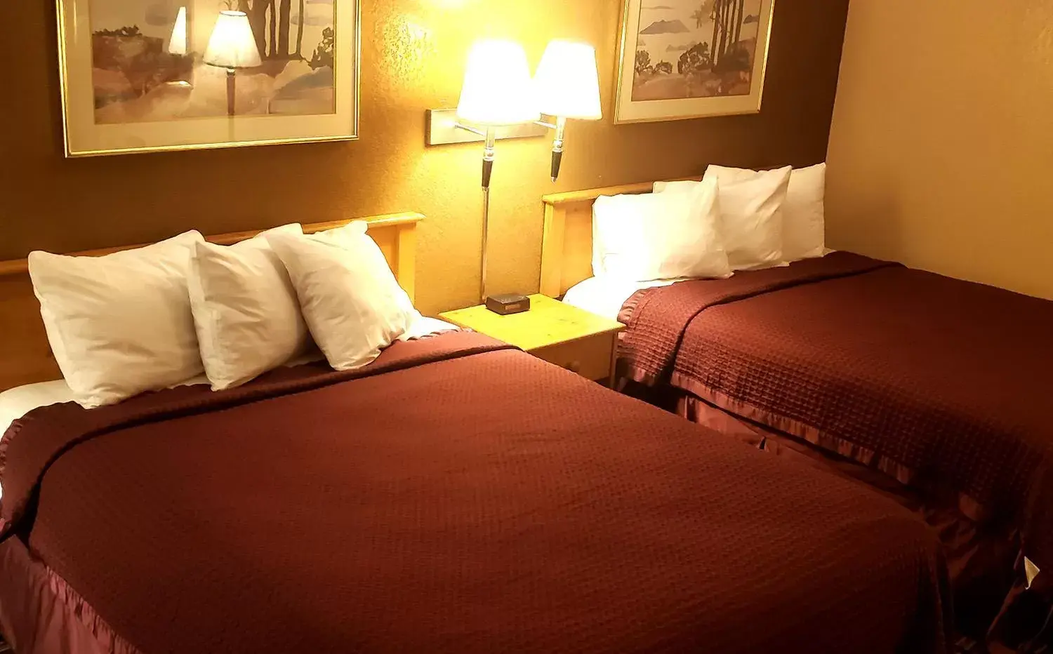 Bed in Coratel Inn & Suites by Jasper Mankato