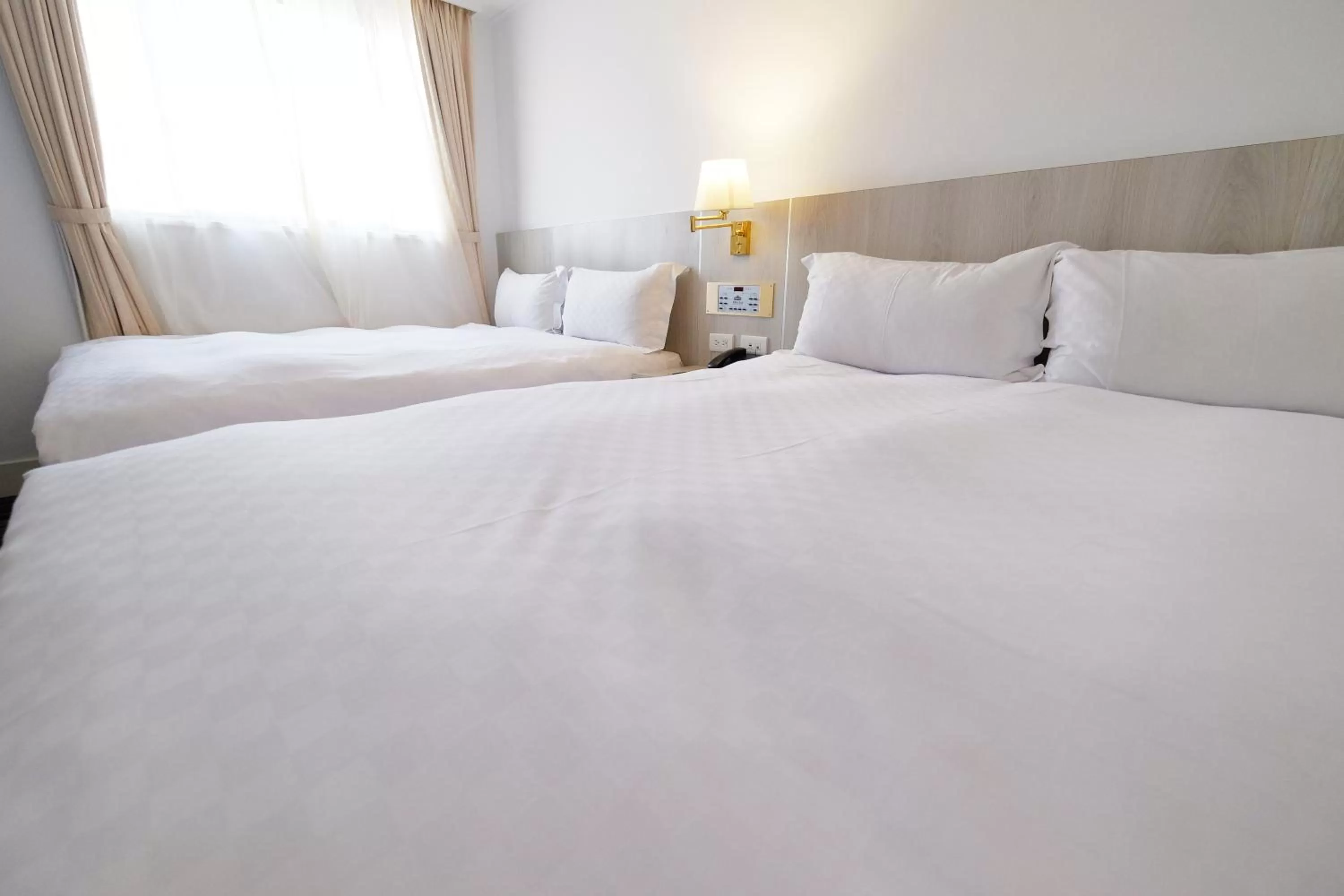 Bed in Dynasty Hotel