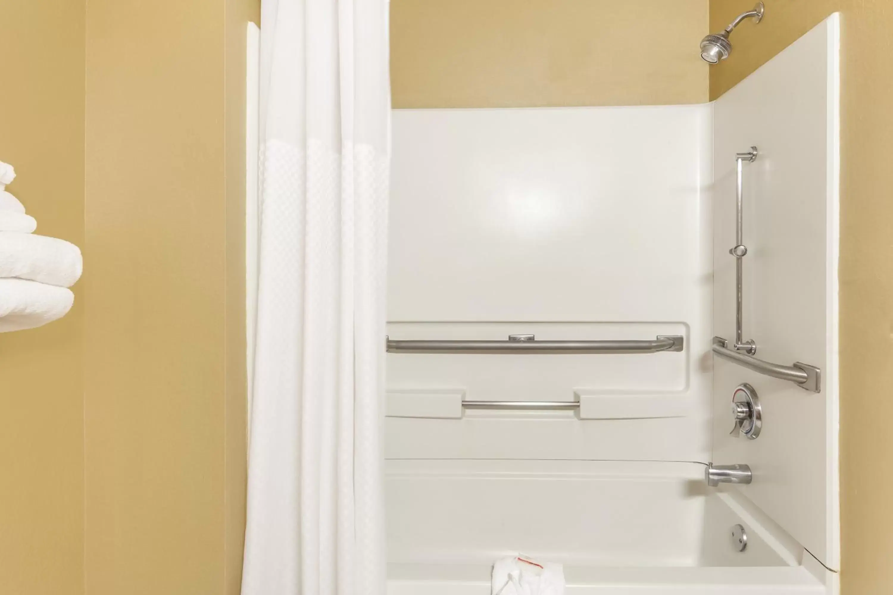 Shower in Super 8 by Wyndham Charlotte/Amusement Park Area Shower in Super 8 by Wyndham Charlotte/Amusement Park Area