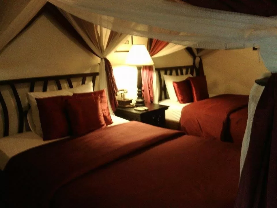 Bed in Tri Yaan Na Ros Colonial House