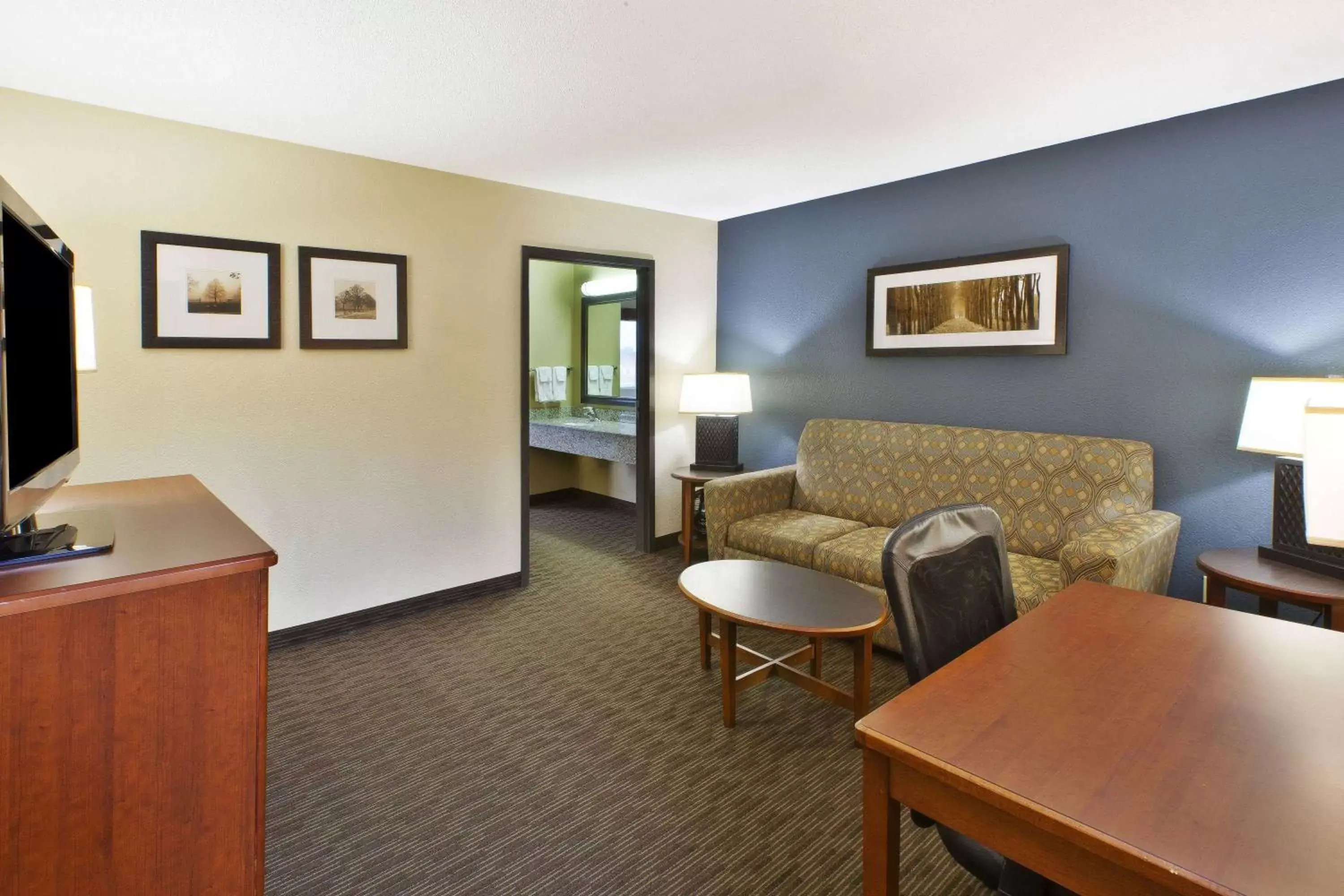 Photo of the whole room, Seating Area in AmericInn by Wyndham Bay City