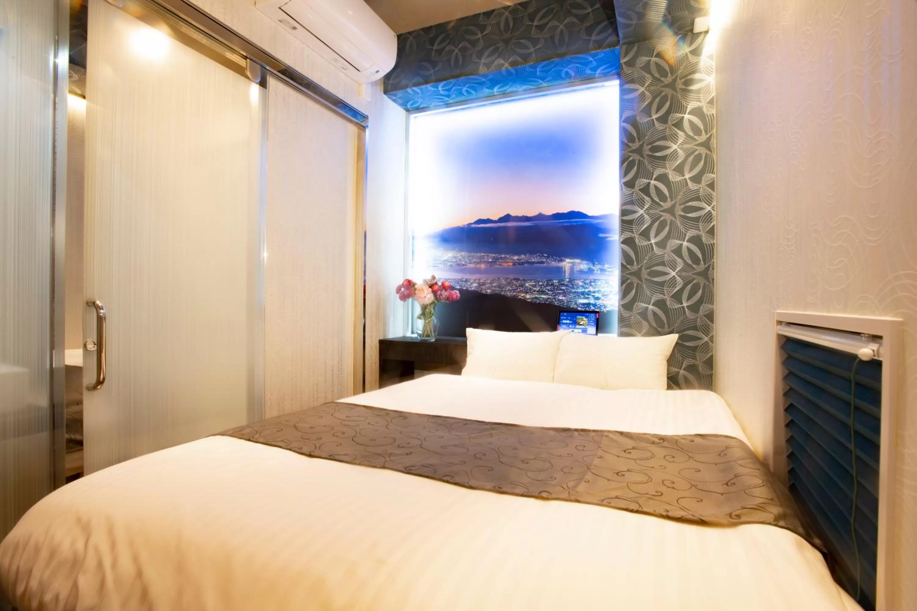 Bed in Hotel Xcell Hiroshima Nagarekawa