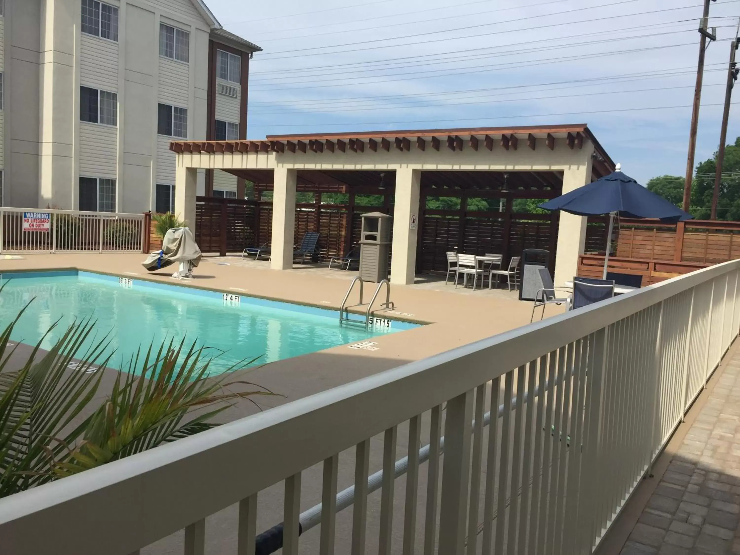 Patio, Pool View in Candlewood Suites - Charlotte - Arrowood, an IHG Hotel