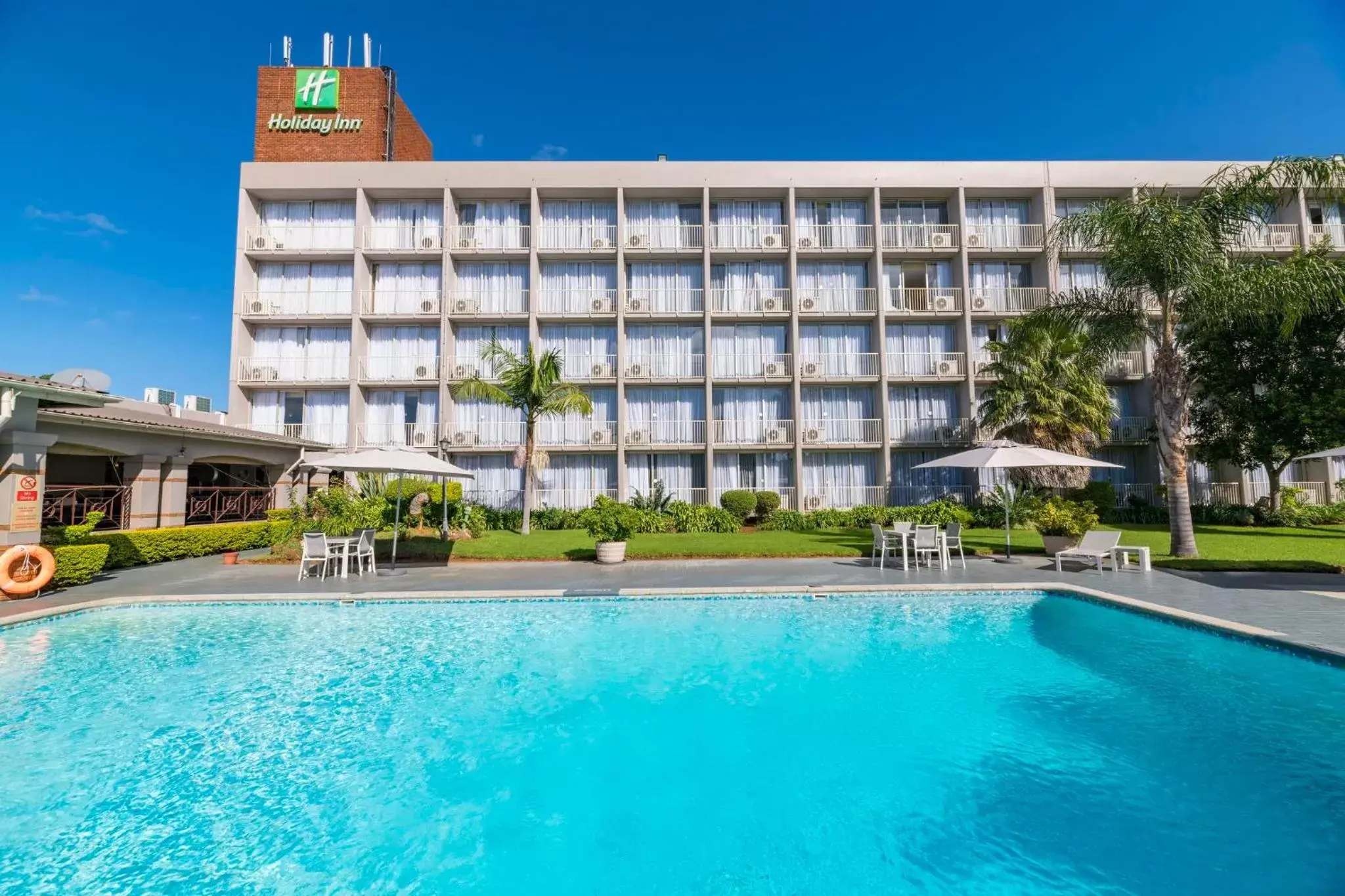 Swimming pool, Property Building in Holiday Inn - Bulawayo, an IHG Hotel