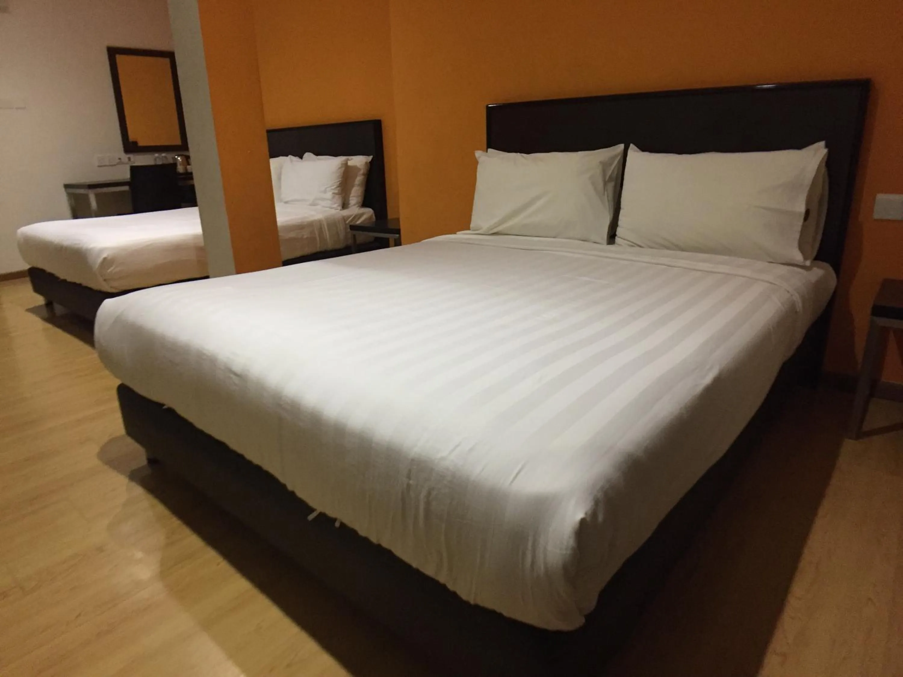 Bed in Padungan Hotel