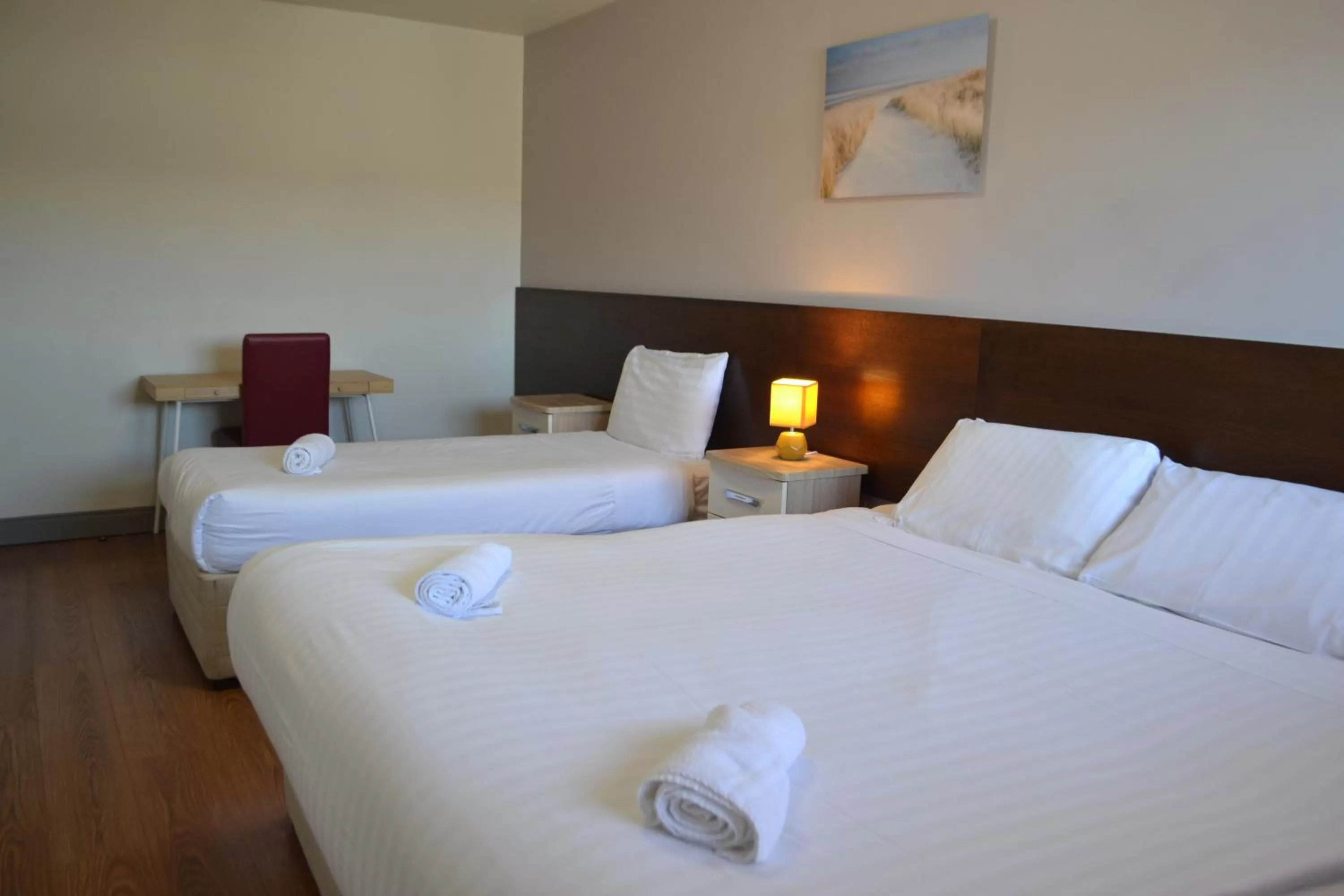 Bed in Walsh's Hotel and Apartments