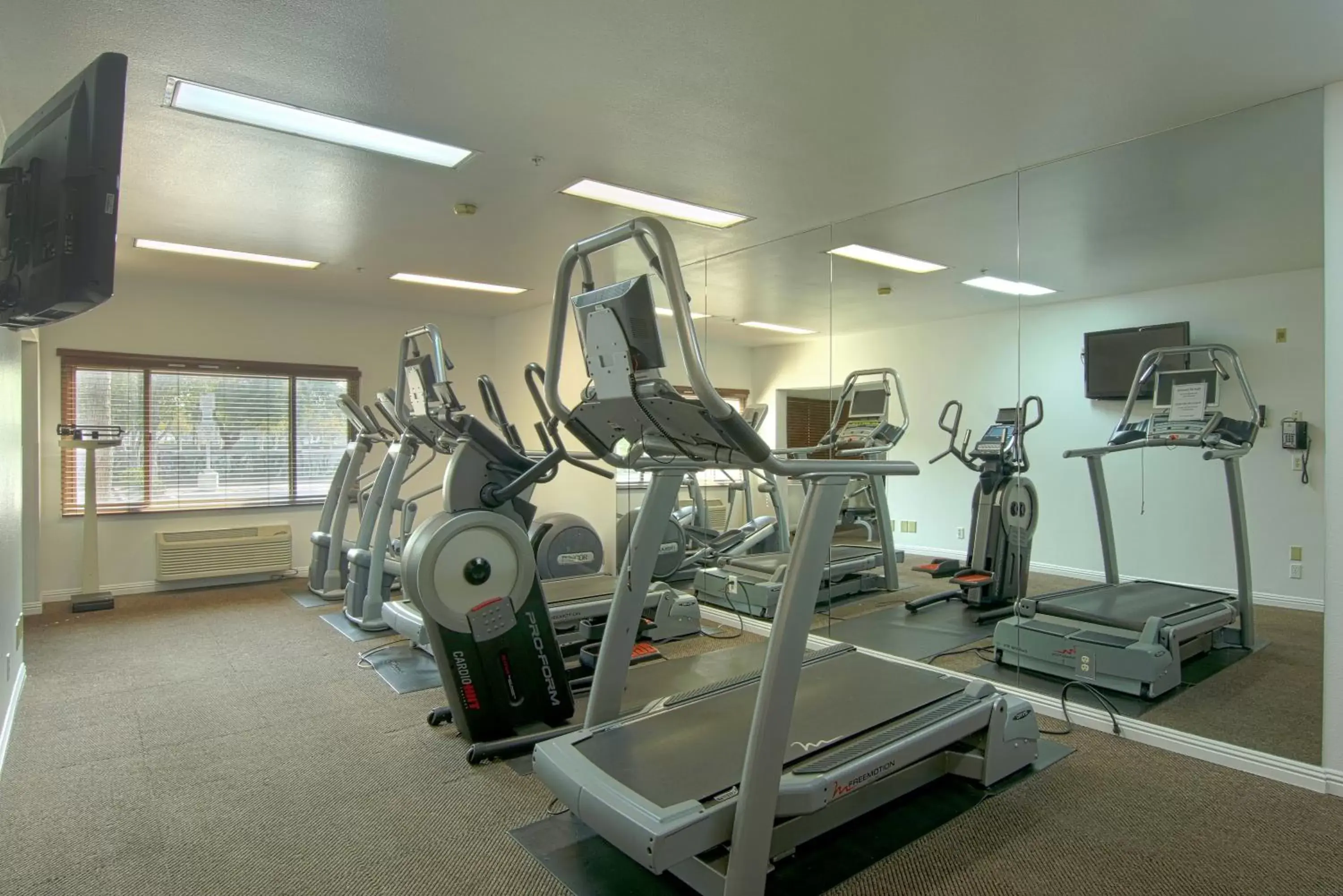 Fitness centre/facilities, Fitness Center/Facilities in Azure Hotel&Suites Ontario Trademark Collection by Wyndham