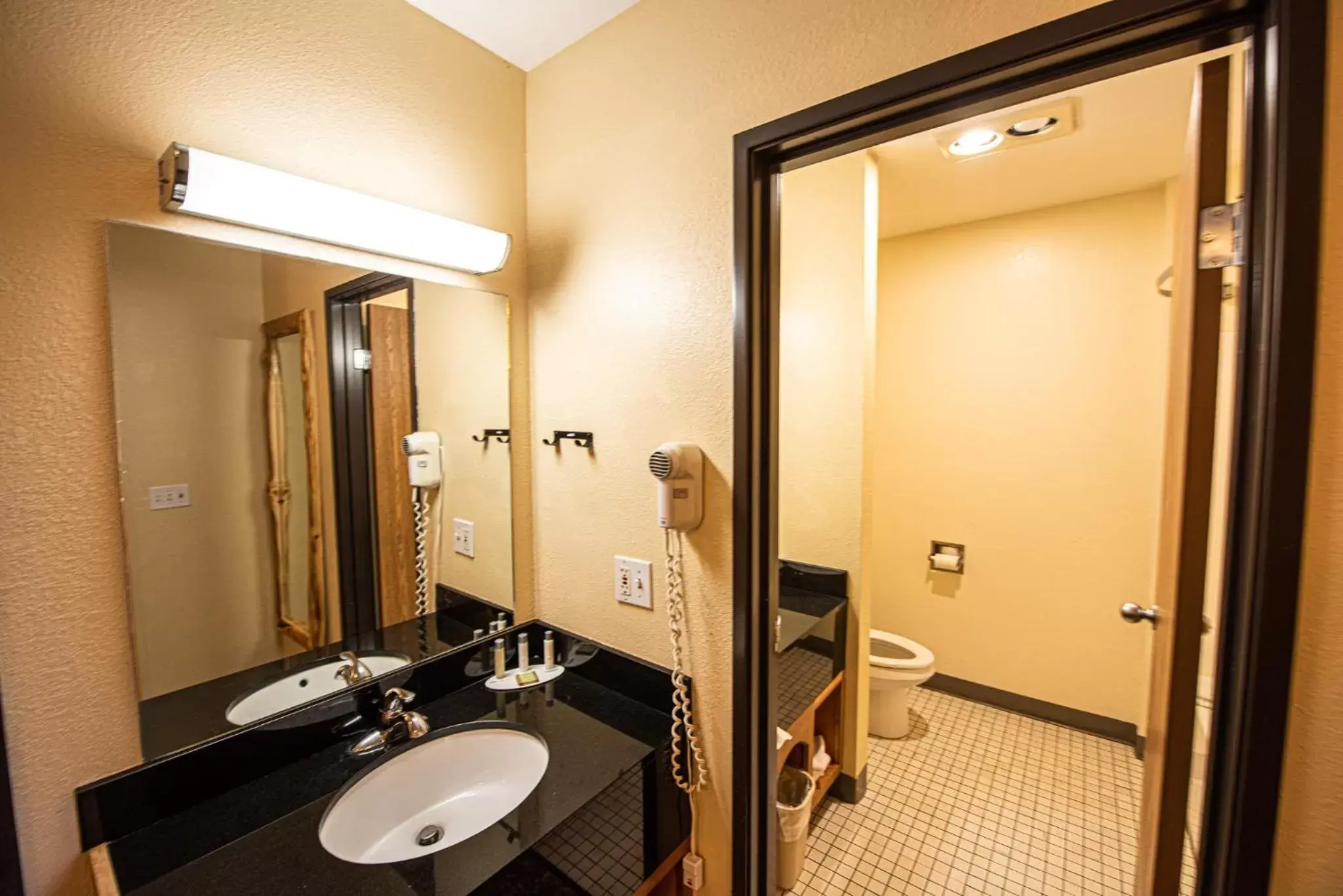 Bathroom in Super 8 by Wyndham Bridgeview of Mackinaw City