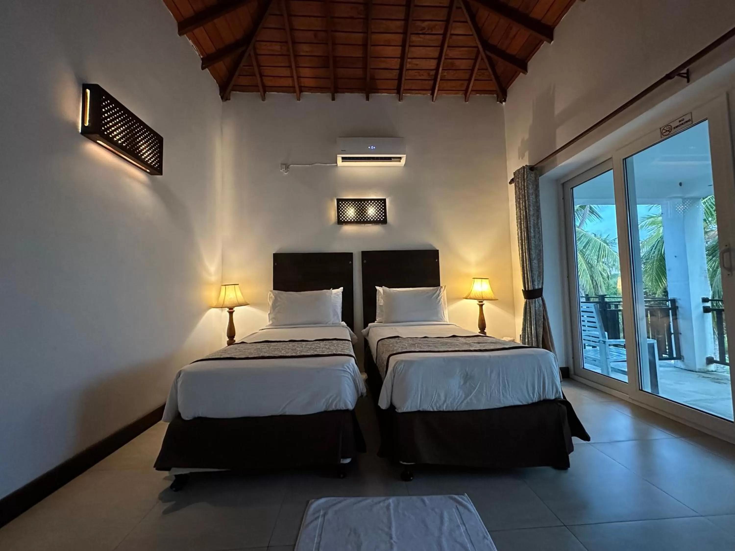 Photo of the whole room, Bed in Amaluna Resorts