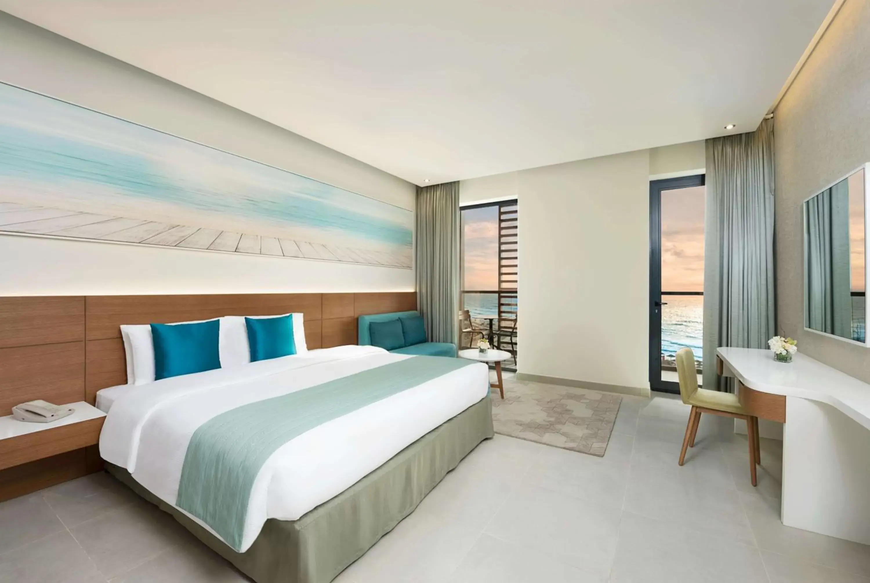 Photo of the whole room, Bed in Wyndham Garden Ajman Corniche