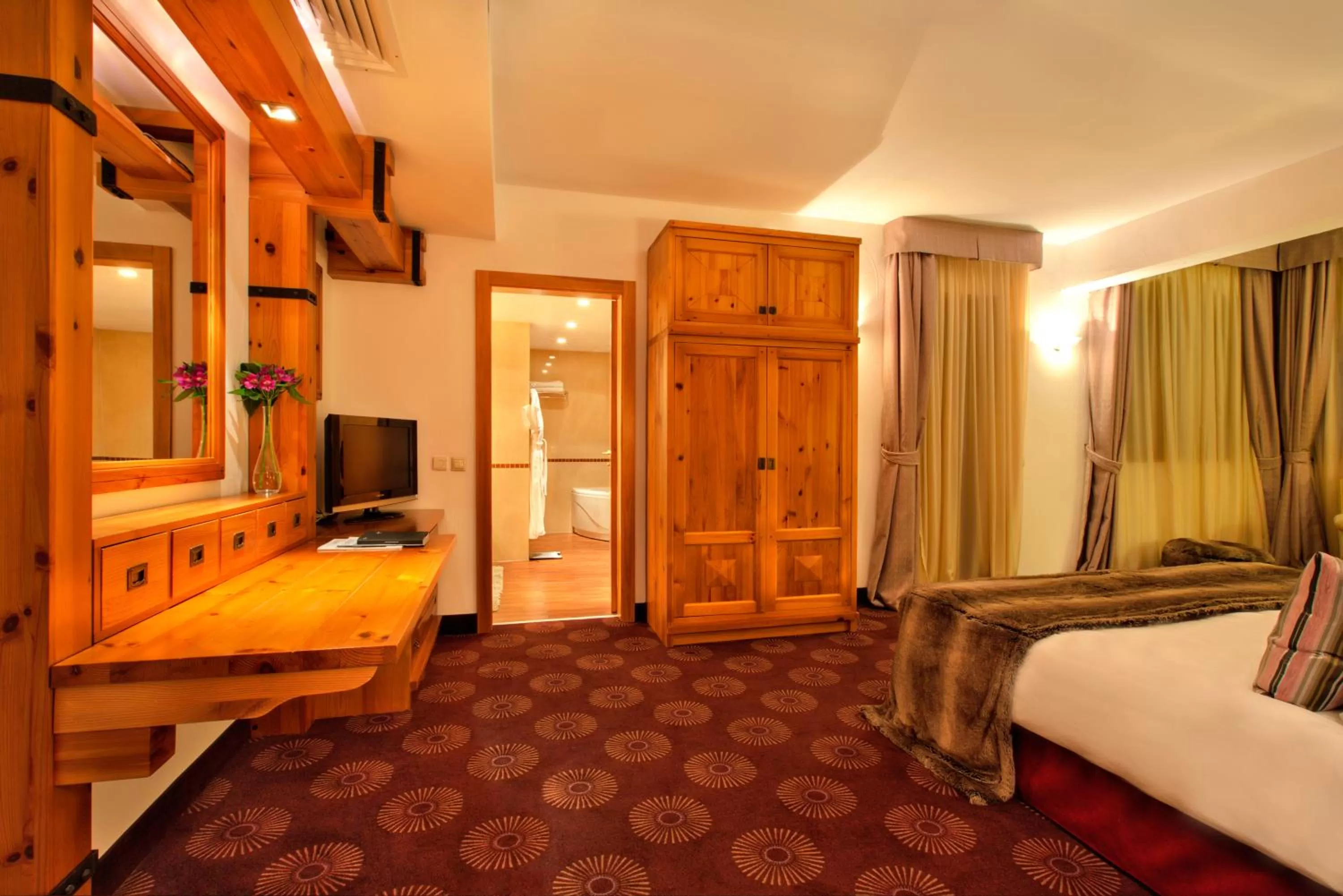 TV and multimedia, Bed in Kempinski Hotel Grand Arena Bansko