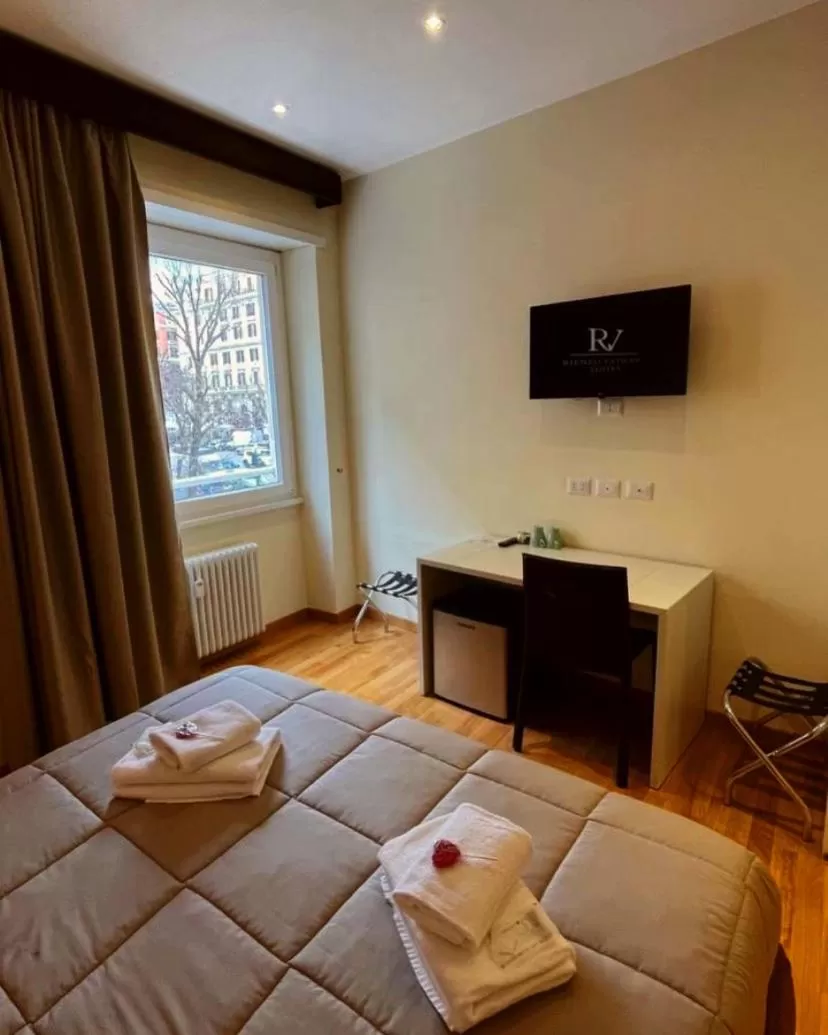 Bed in Rienzo Vatican Suites