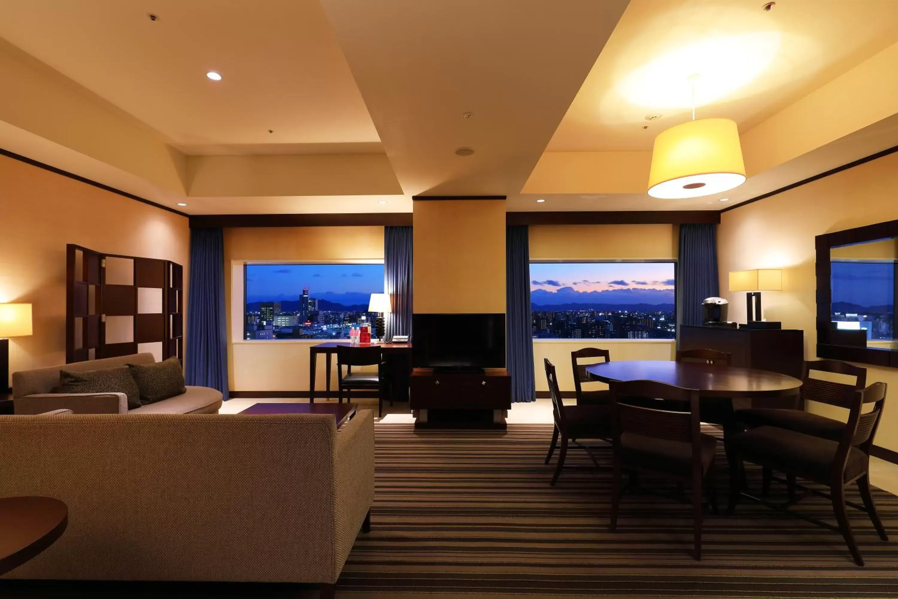 Living room in ANA Crowne Plaza Okayama, an IHG Hotel