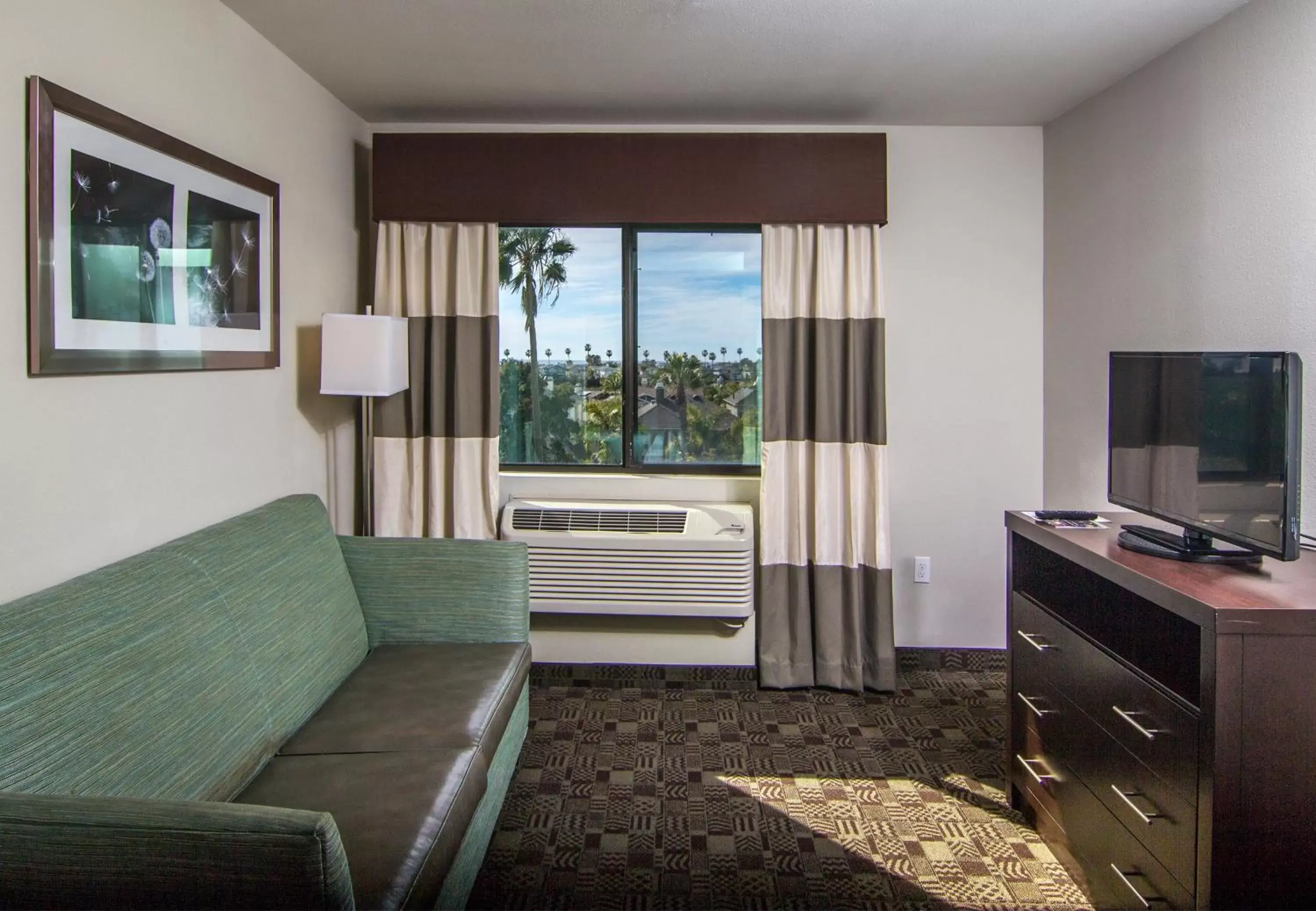 Bedroom, Seating Area in Holiday Inn Express Hotel & Suites Carlsbad Beach, an IHG Hotel