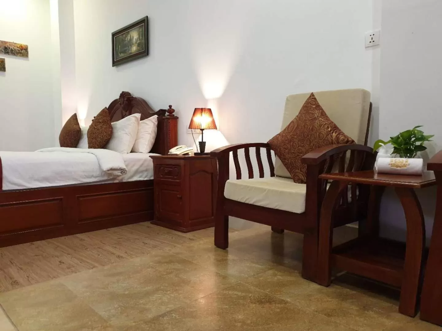 Seating area, Bed in Aristocrat Residence & Hotel