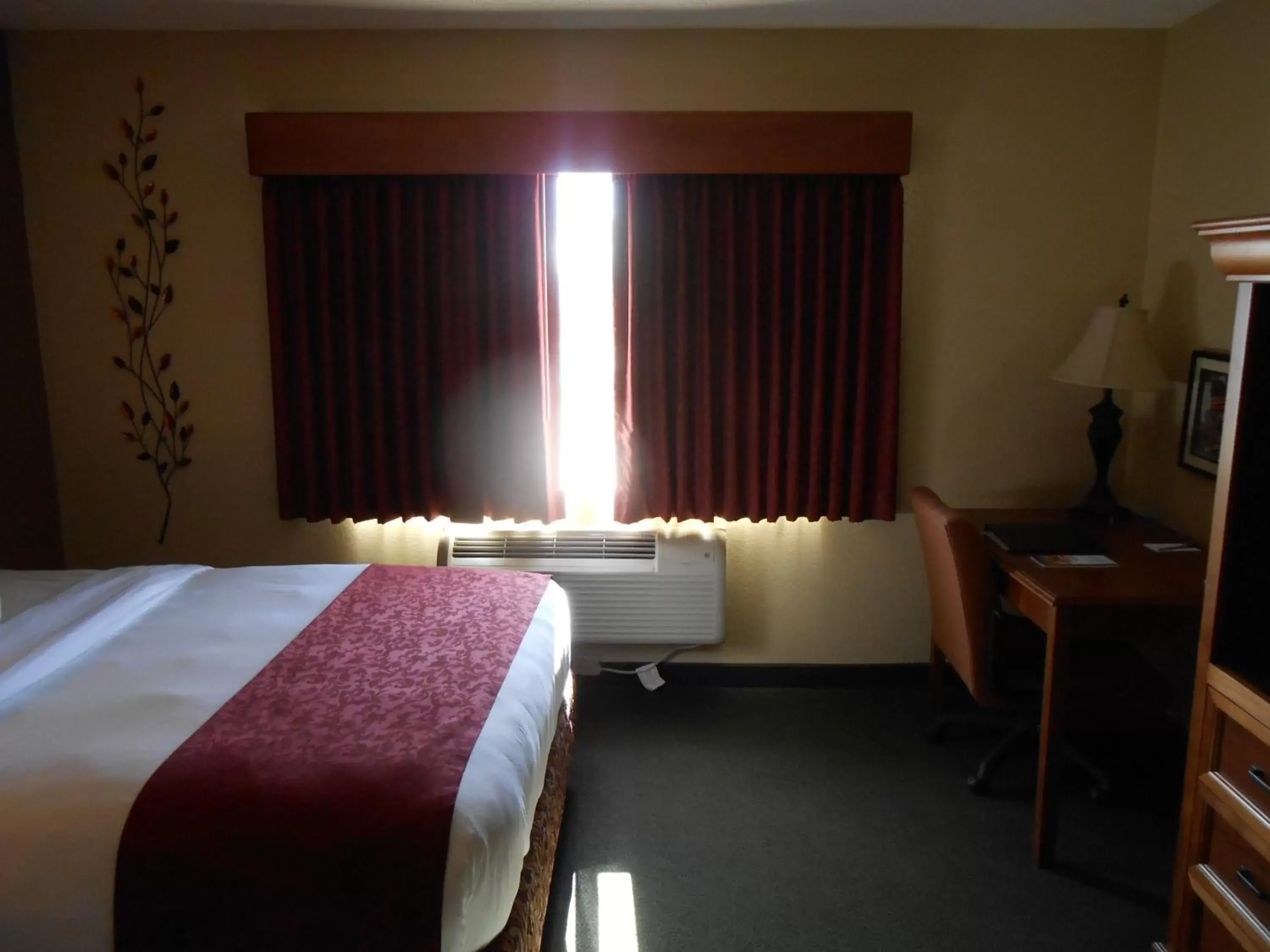 Bed in AmericInn by Wyndham McAlester