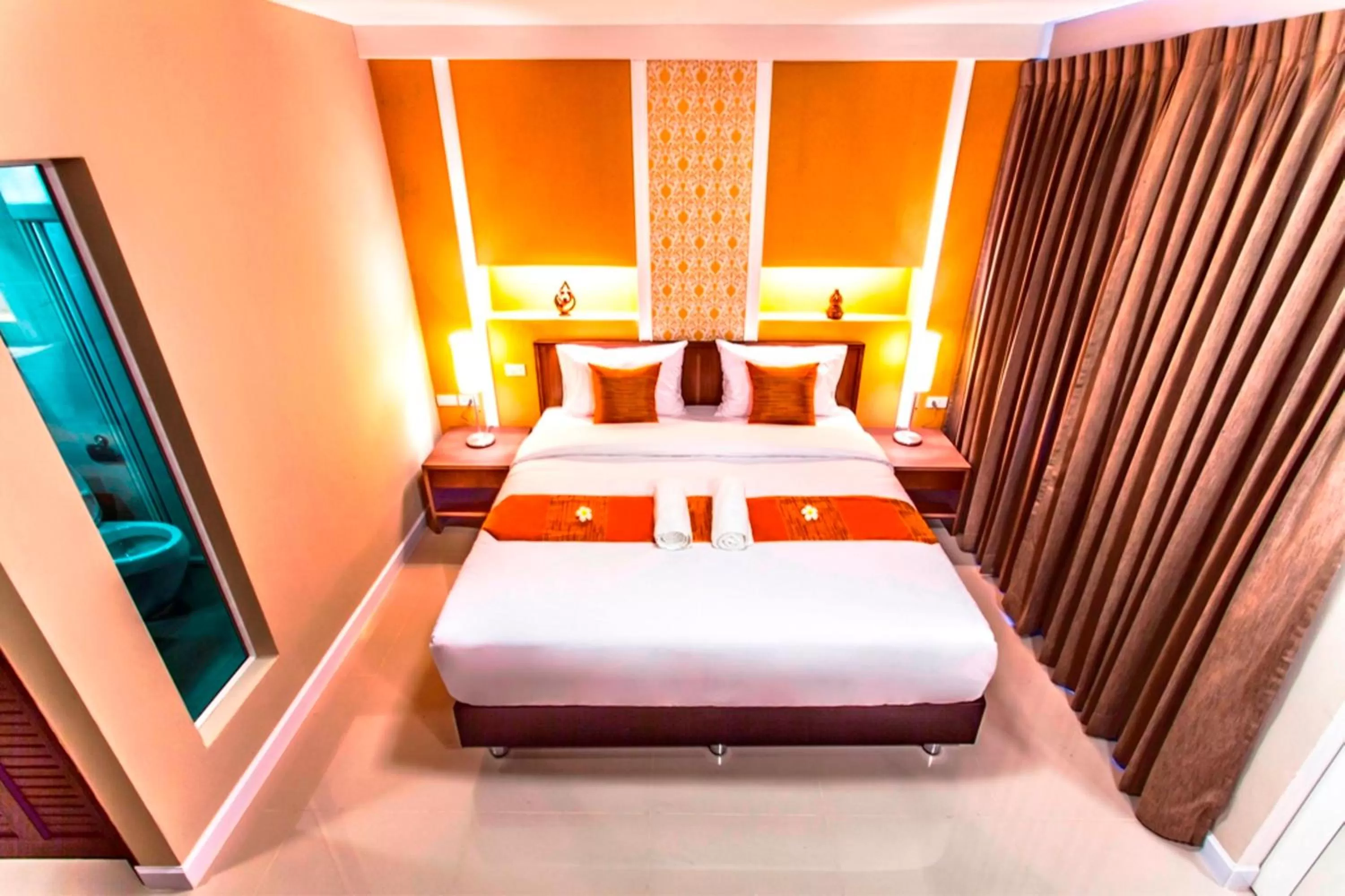 Photo of the whole room, Bed in The Aim Sathorn Hotel