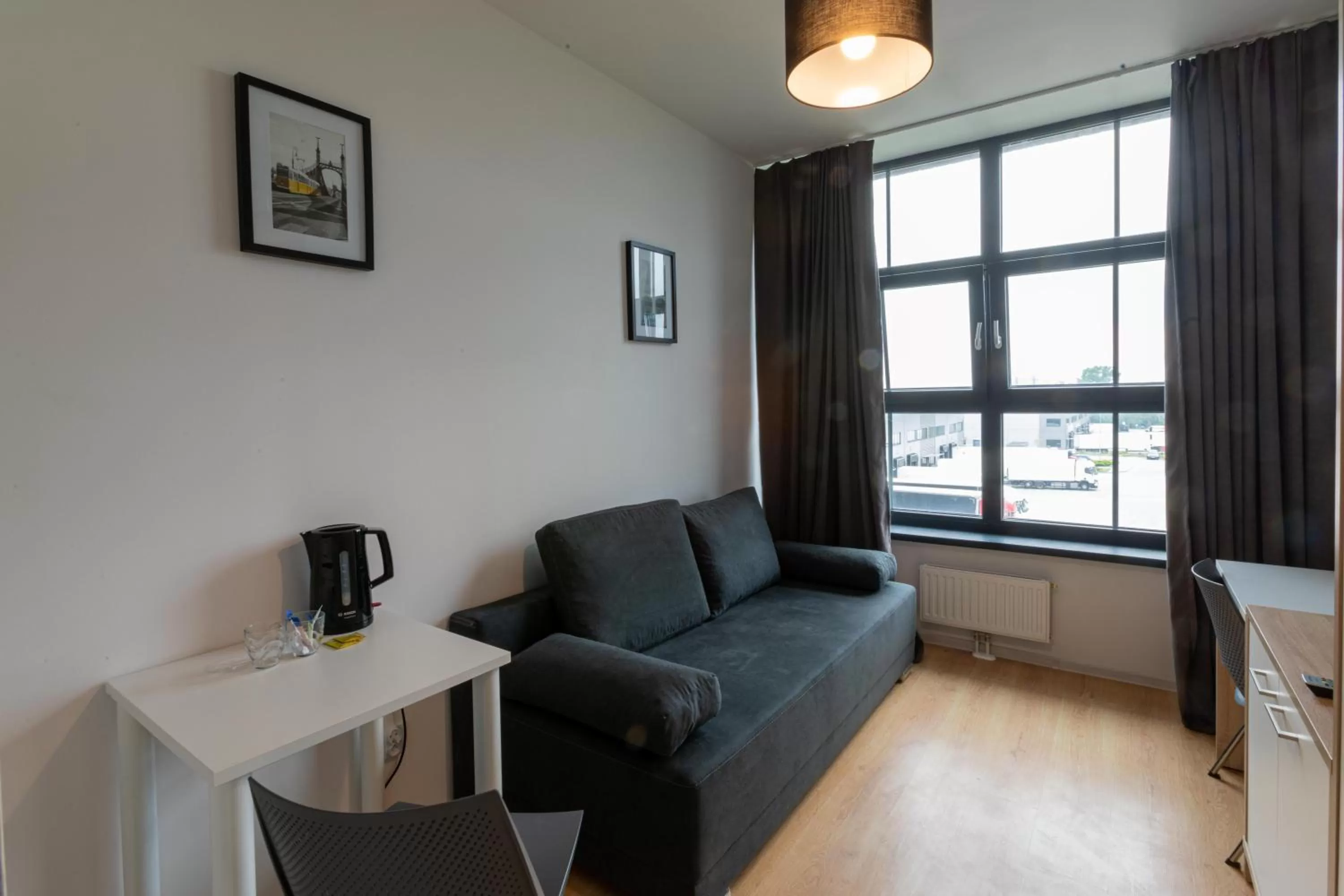 Bed in SleepWell Apartments