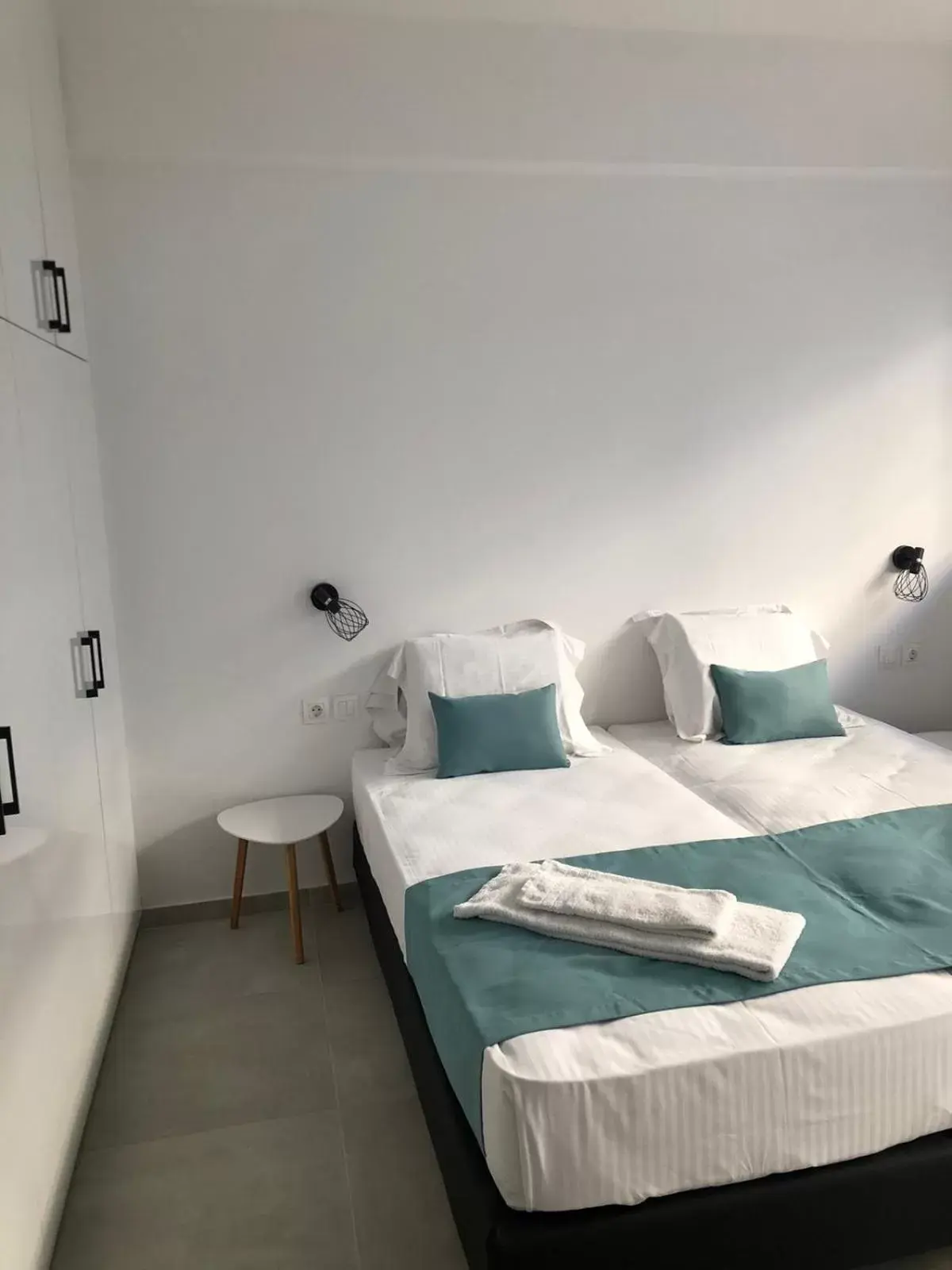 Bed in Evita's Luxury Apartments