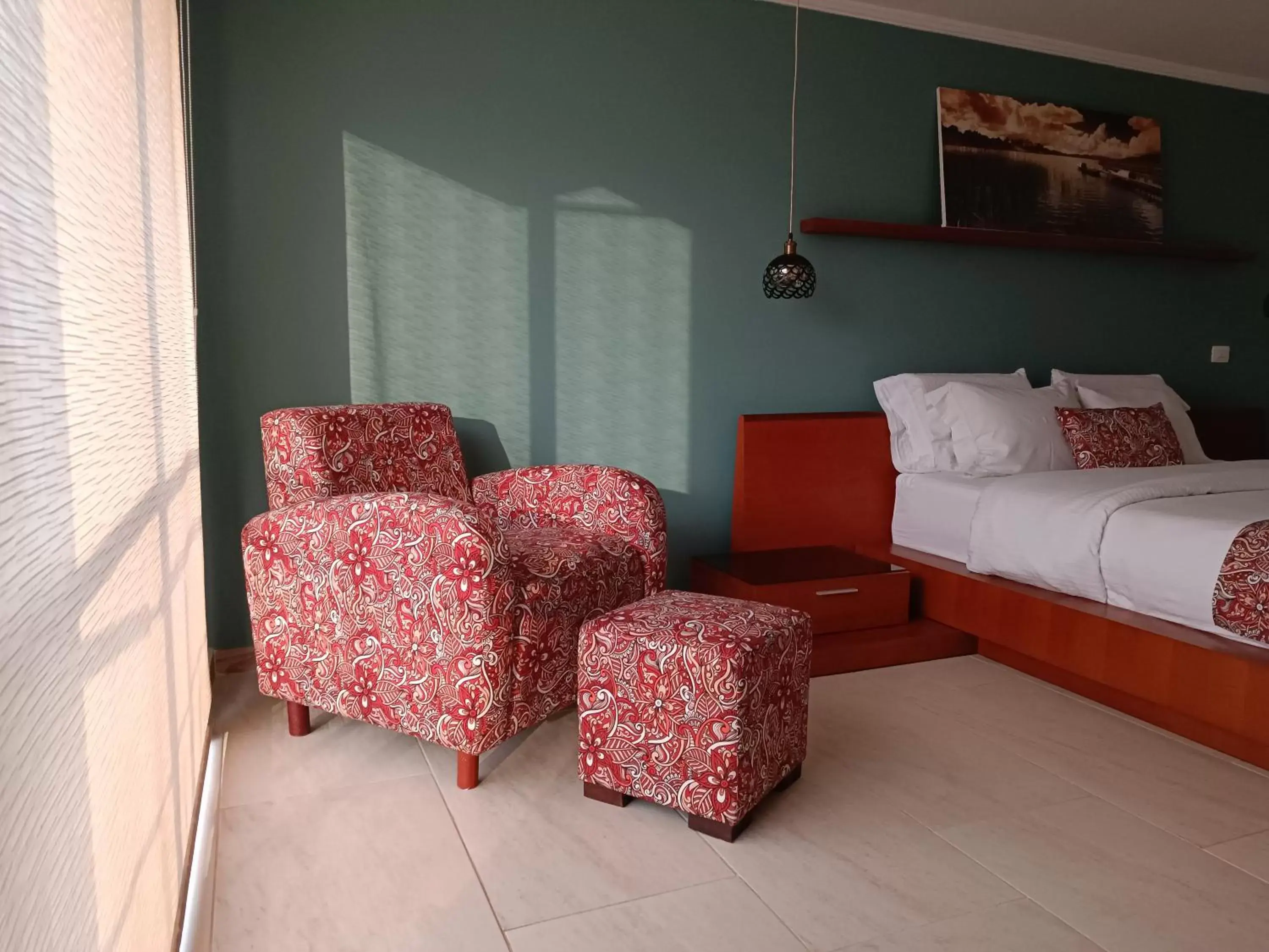 Bed, Seating Area in Hotel Boutique Confort Suites