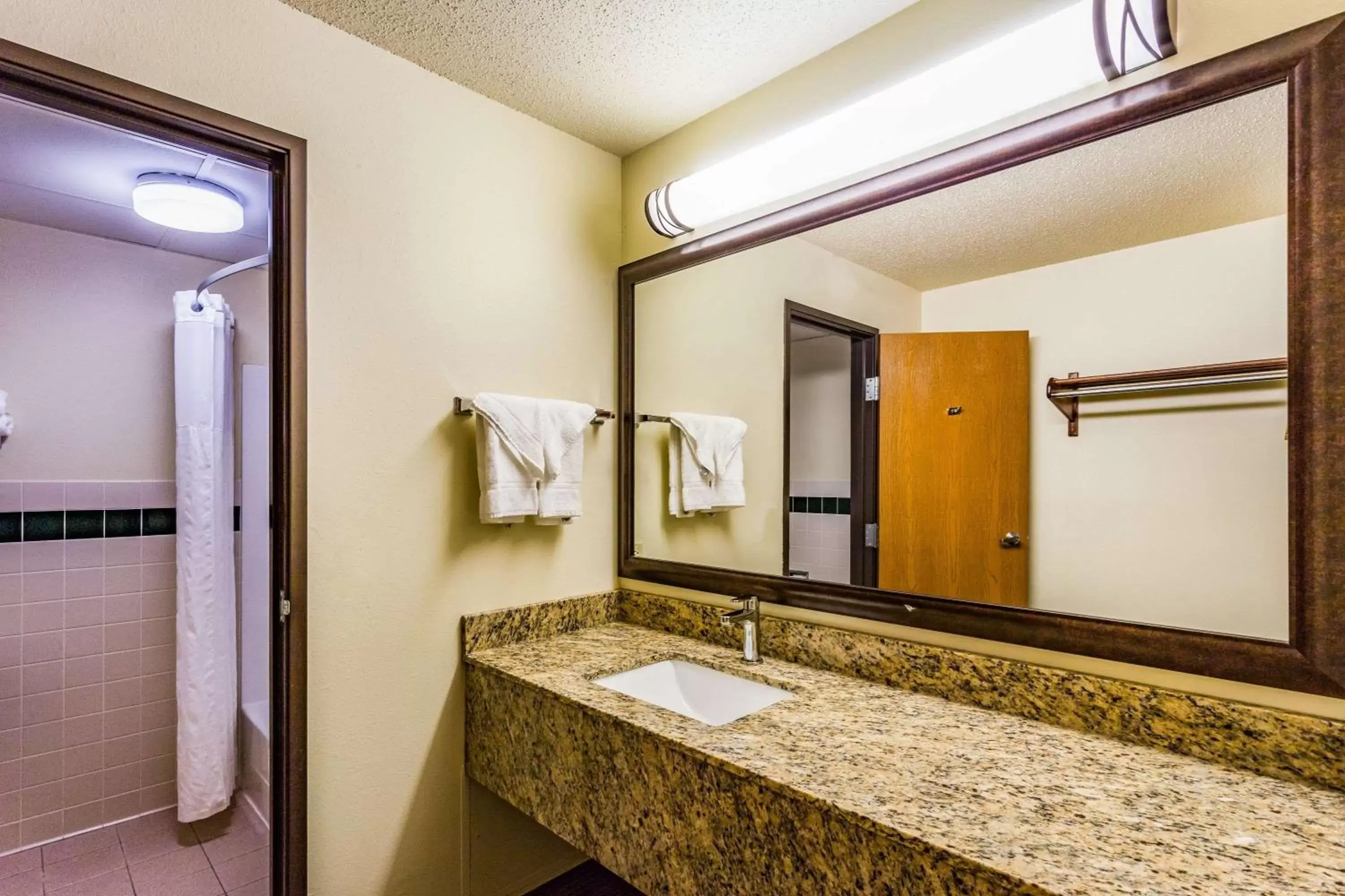 Bathroom in AmericInn by Wyndham Hampton