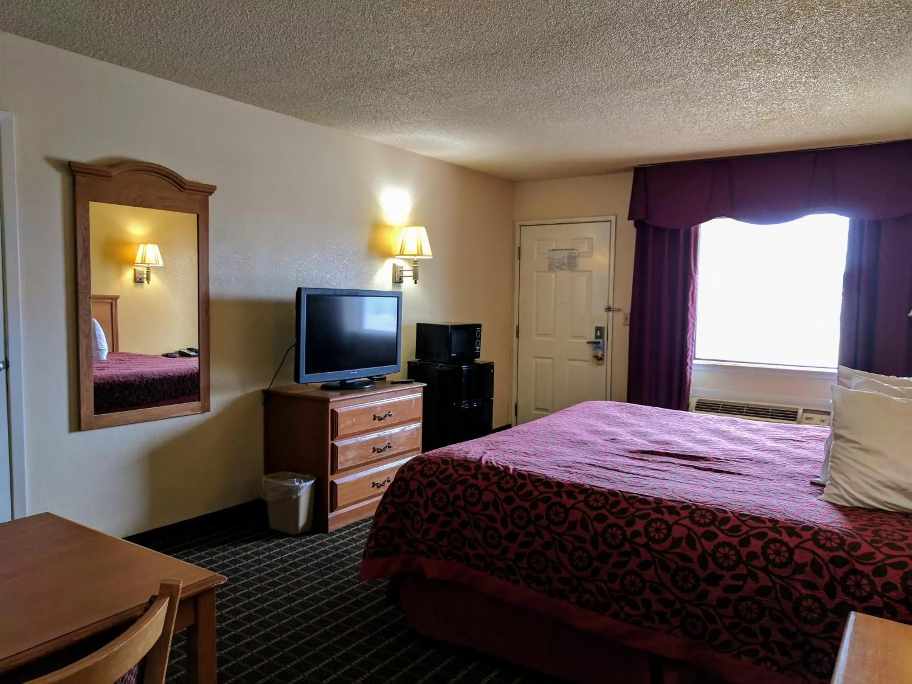 Photo of the whole room, TV/Entertainment Center in Days Inn by Wyndham San Antonio Interstate Hwy 35 North