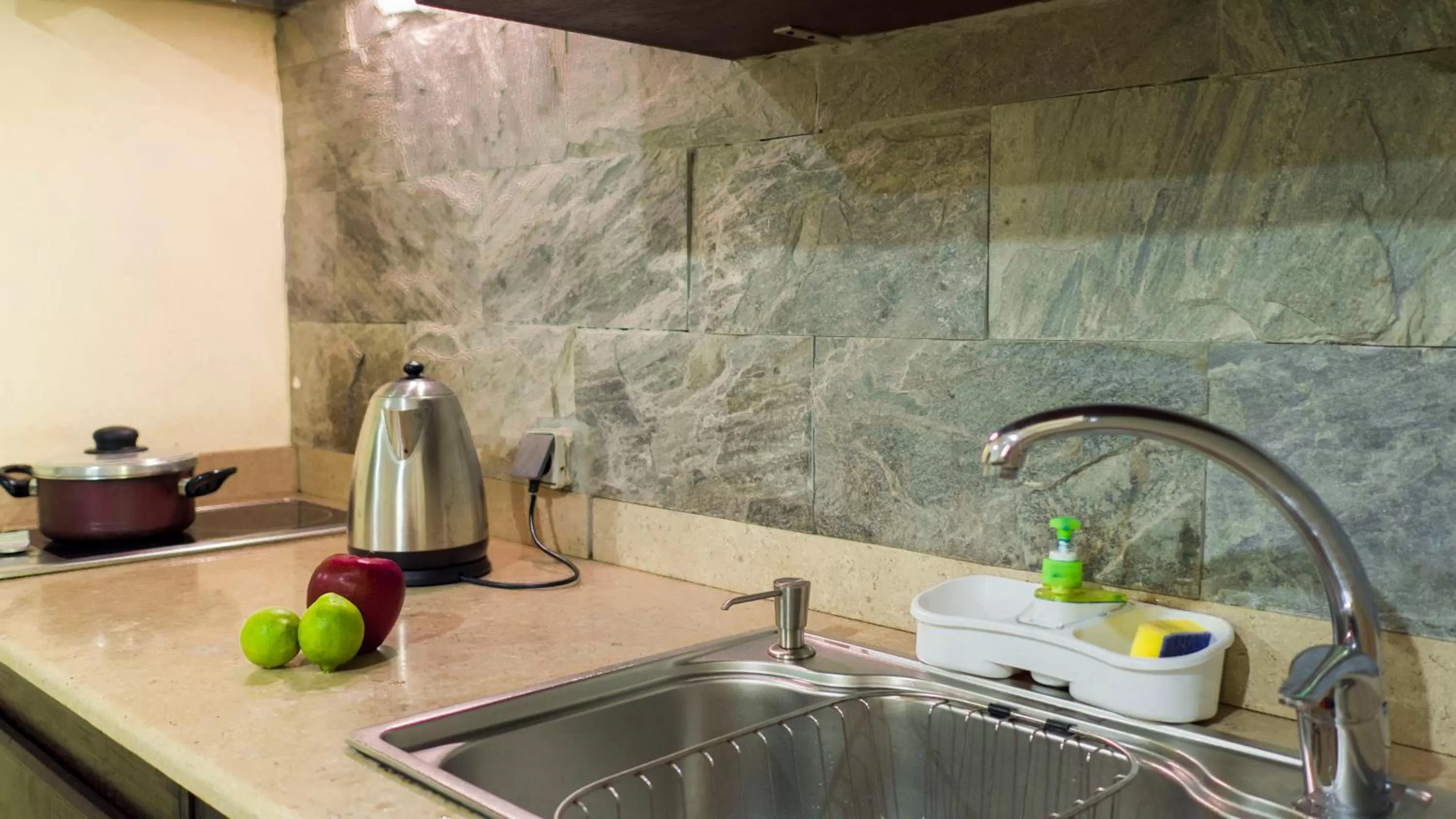 Kitchen or kitchenette in NewCity Hotel & Suites