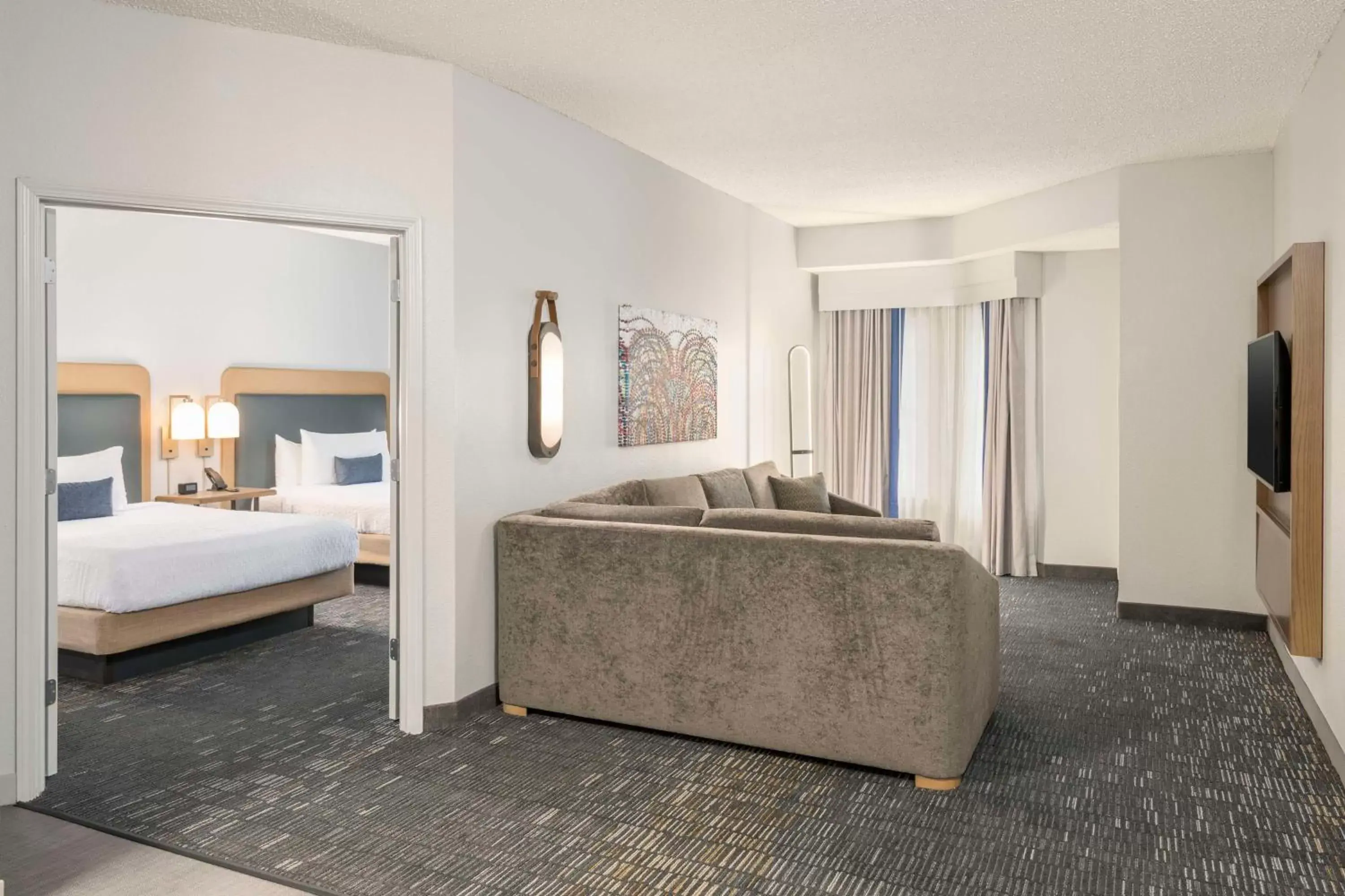 Living room, Bed in Homewood Suites by Hilton New Orleans