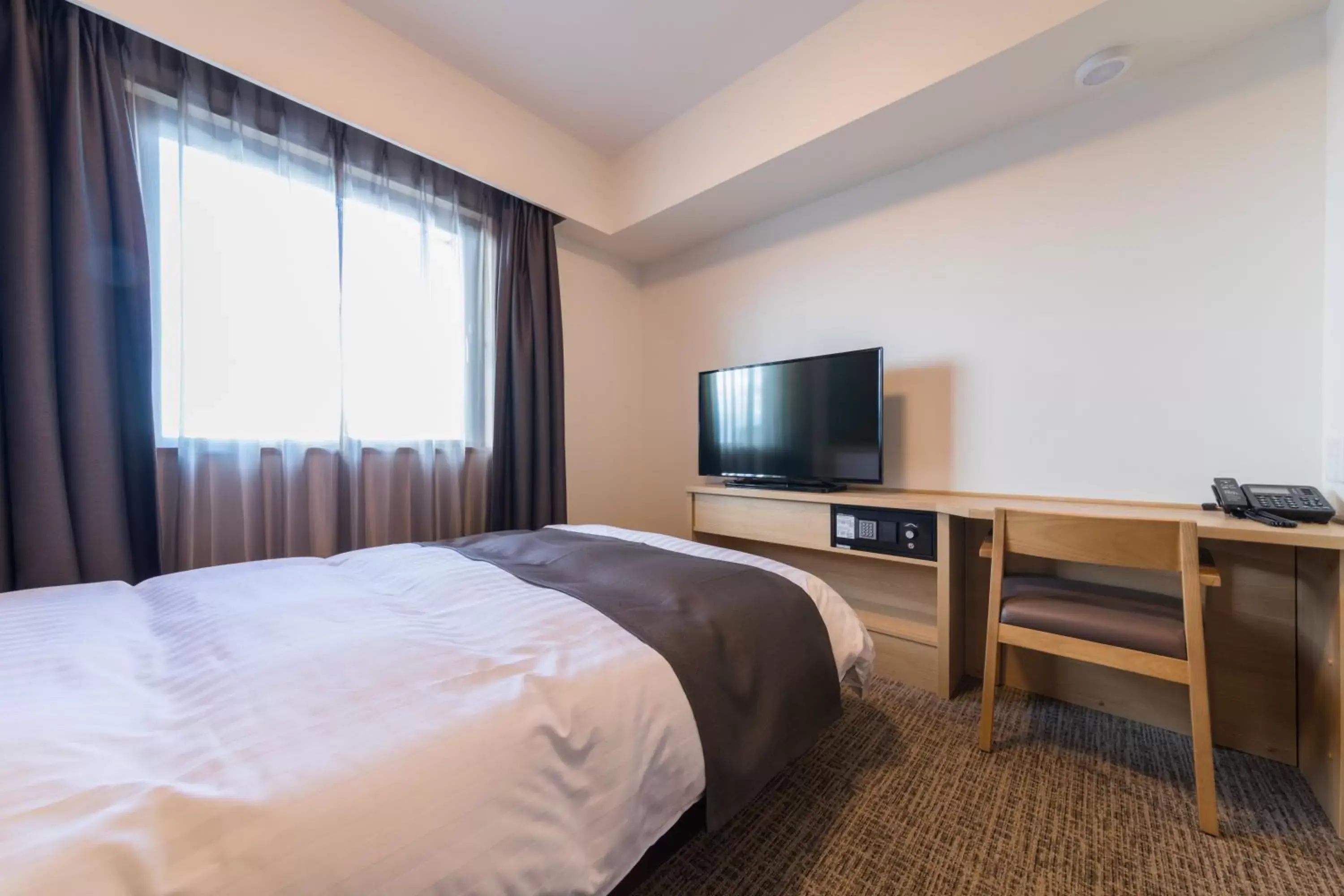 Photo of the whole room, Bed in Dormy Inn Matsuyama Natural Hot Spring