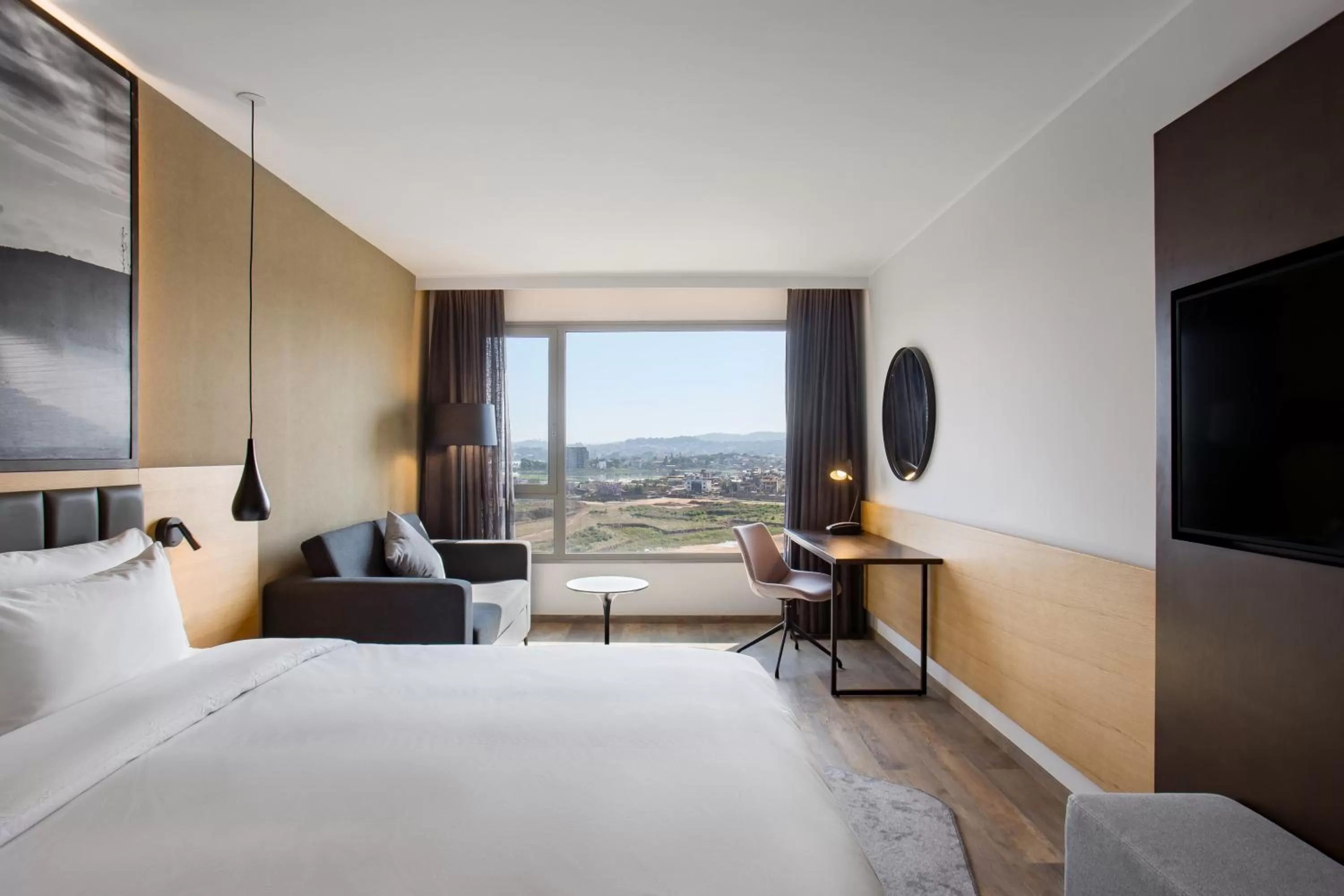Photo of the whole room, Bed in Radisson Blu Hotel Antananarivo Waterfront