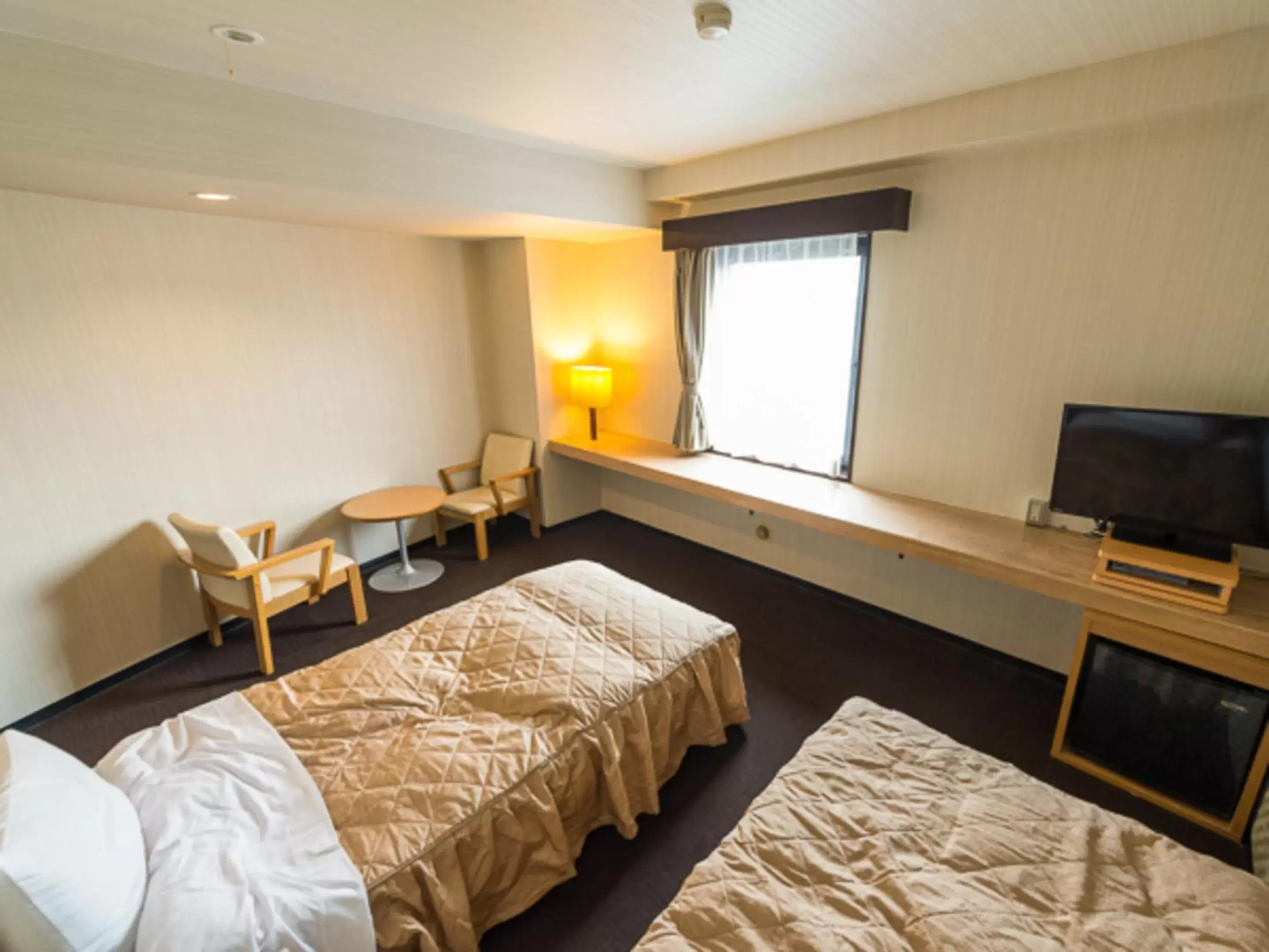 Bed in HOTEL LiVEMAX Kofu