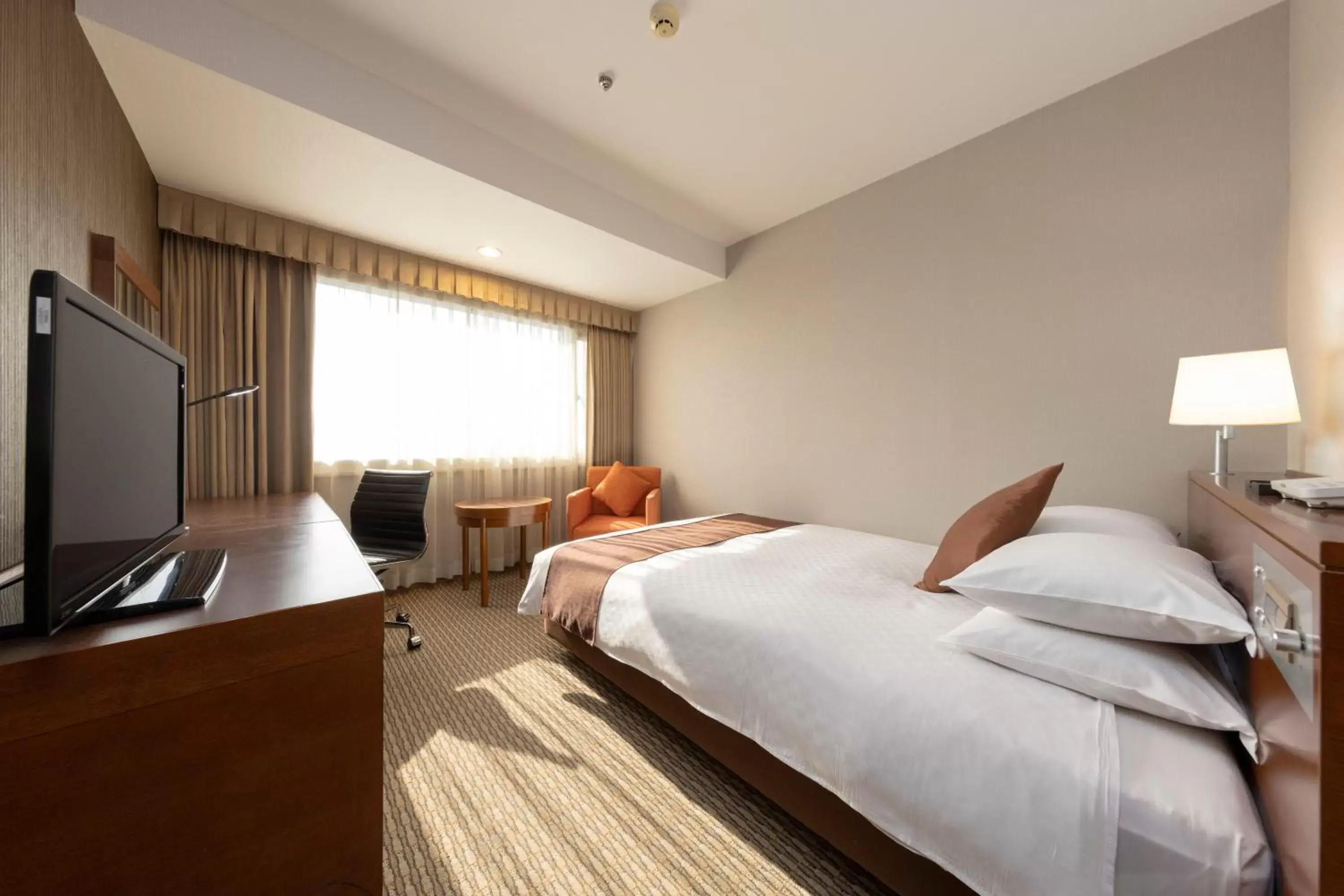 Bed in Meitetsu Grand Hotel