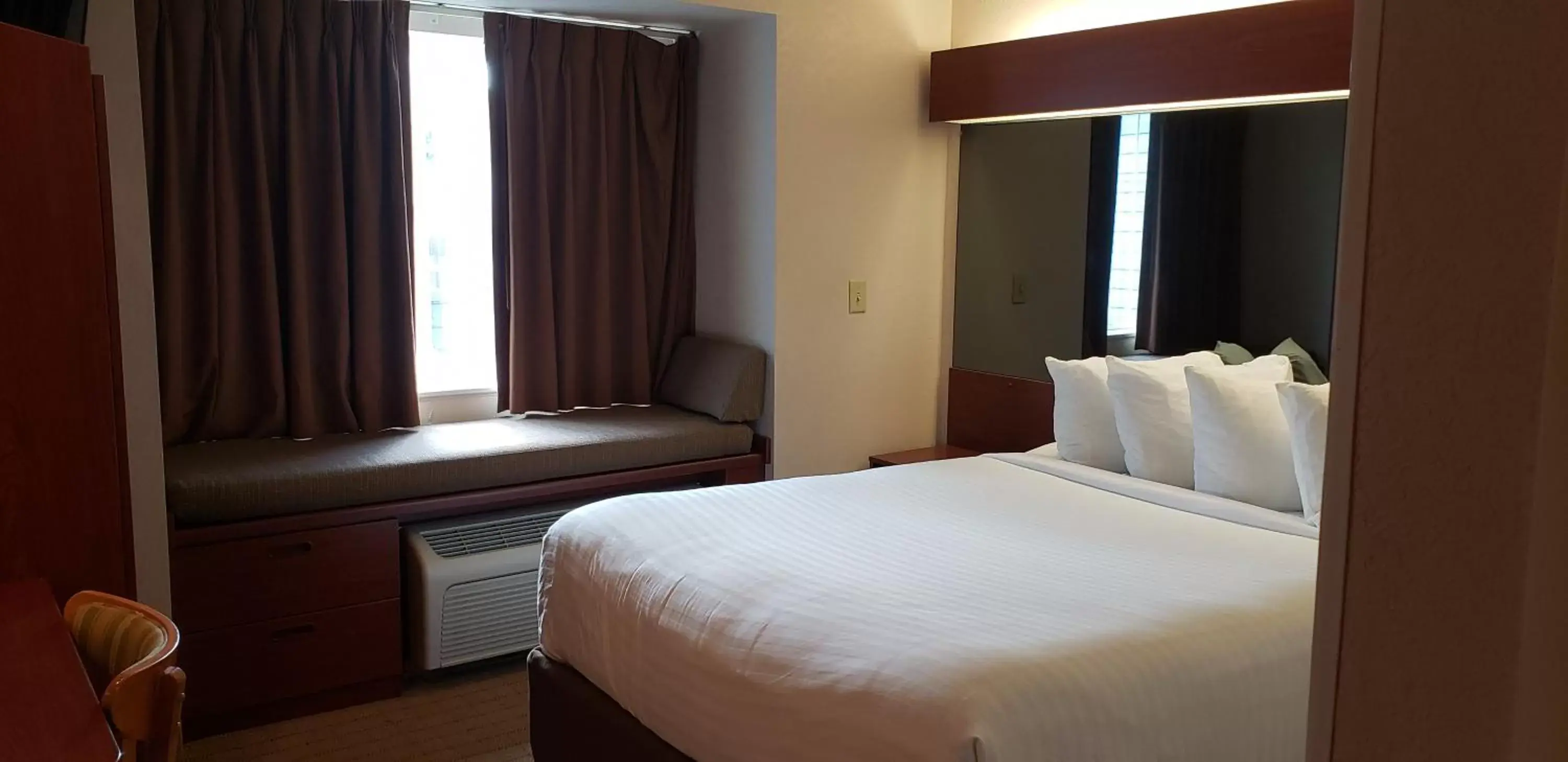 Bed in Microtel Inn & Suites by Wyndham Wellsville