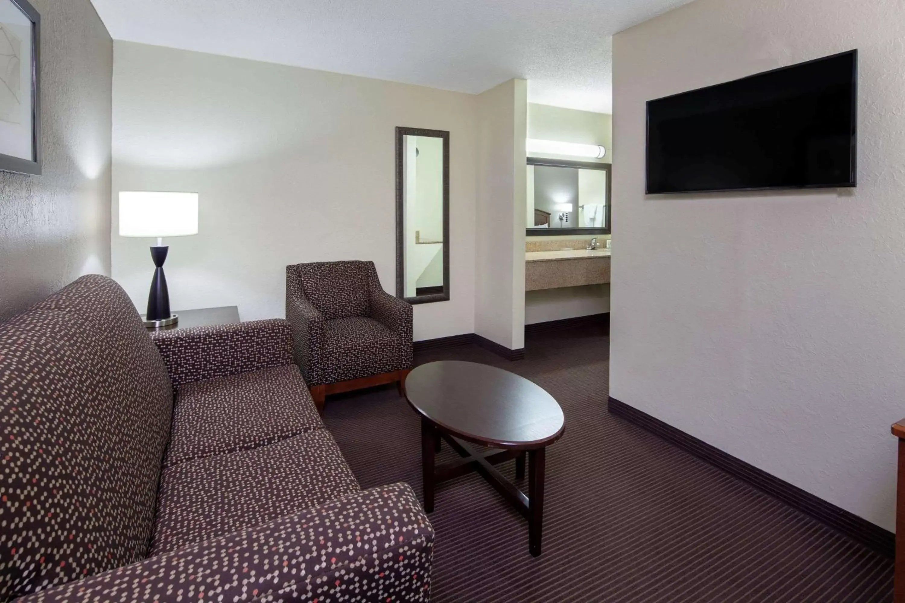 Photo of the whole room, Seating Area in AmericInn by Wyndham Ironwood