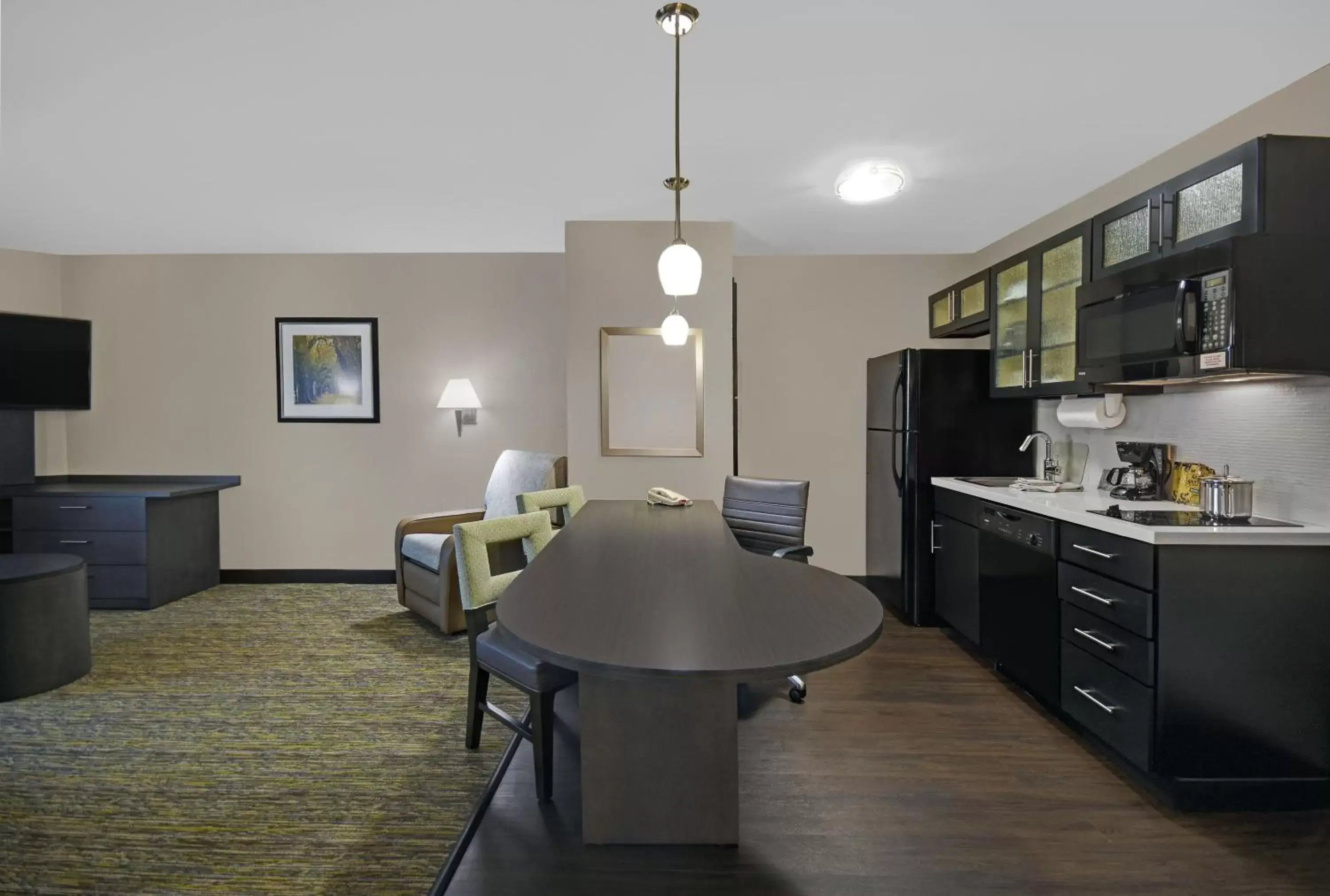 Photo of the whole room, Kitchen/Kitchenette in Candlewood Suites Sumter, an IHG Hotel